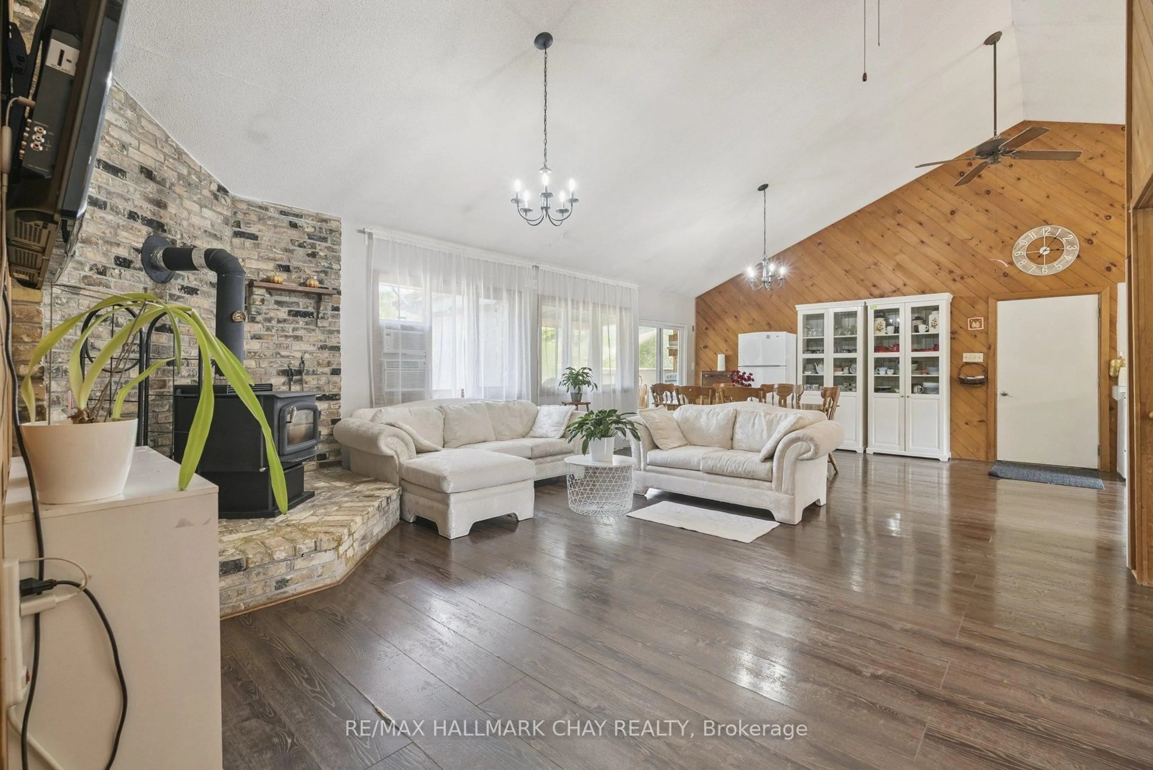 Living room with furniture, wood/laminate floor for 7521 County Road 10, Essa Ontario L0M 1B1
