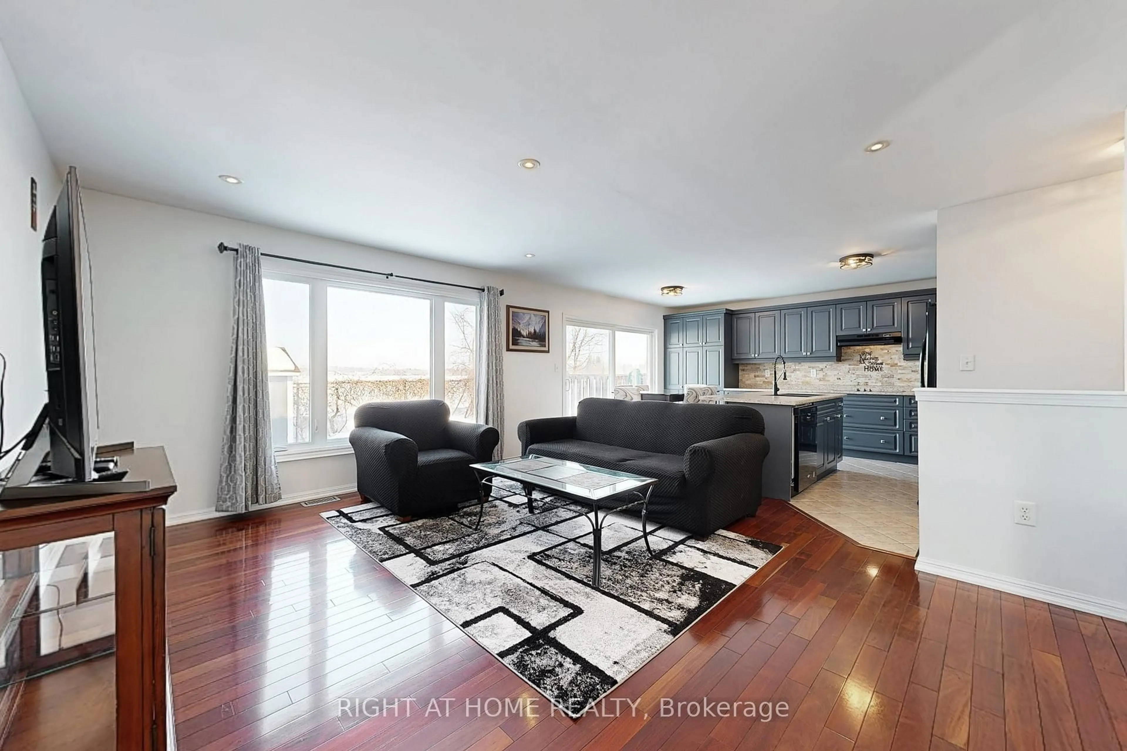 Living room with furniture, wood/laminate floor for 78 John W Taylor Ave, New Tecumseth Ontario L9R 0C9
