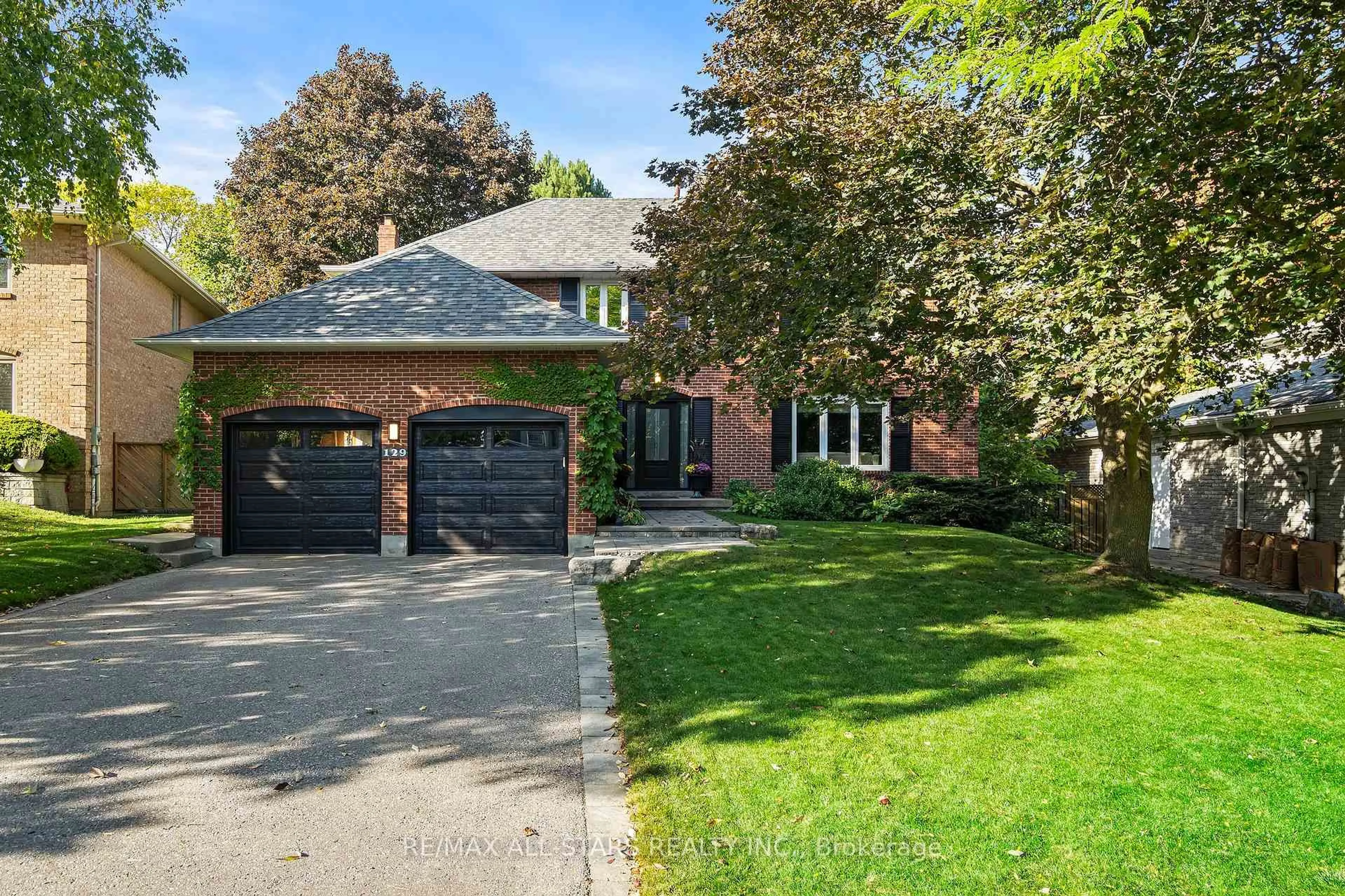 Home with brick exterior material, street for 129 Briarwood Rd, Markham Ontario L3R 2X1