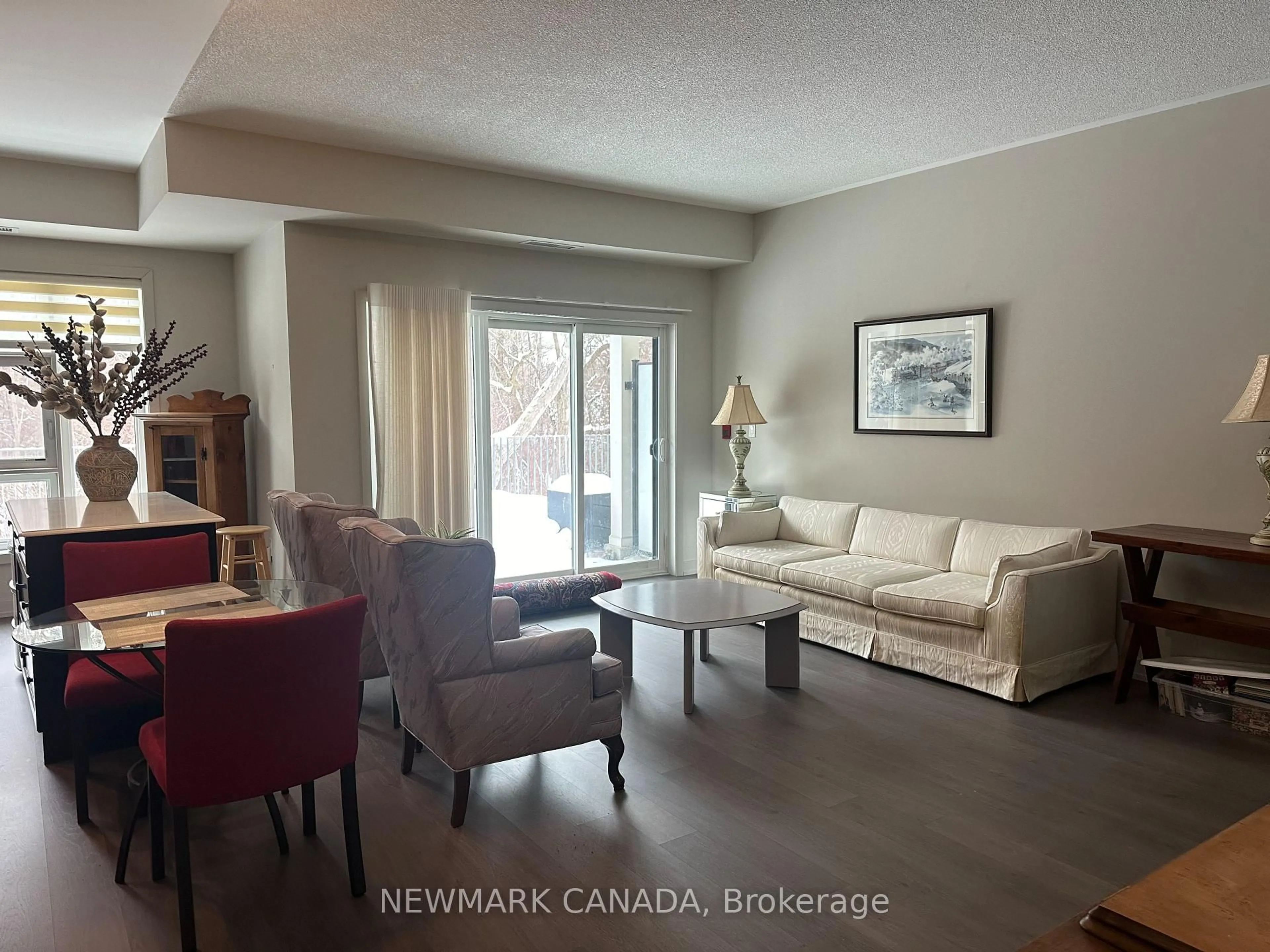 Living room with furniture, wood/laminate floor for 555 William Graham Dr #108, Aurora Ontario L4G 3L1