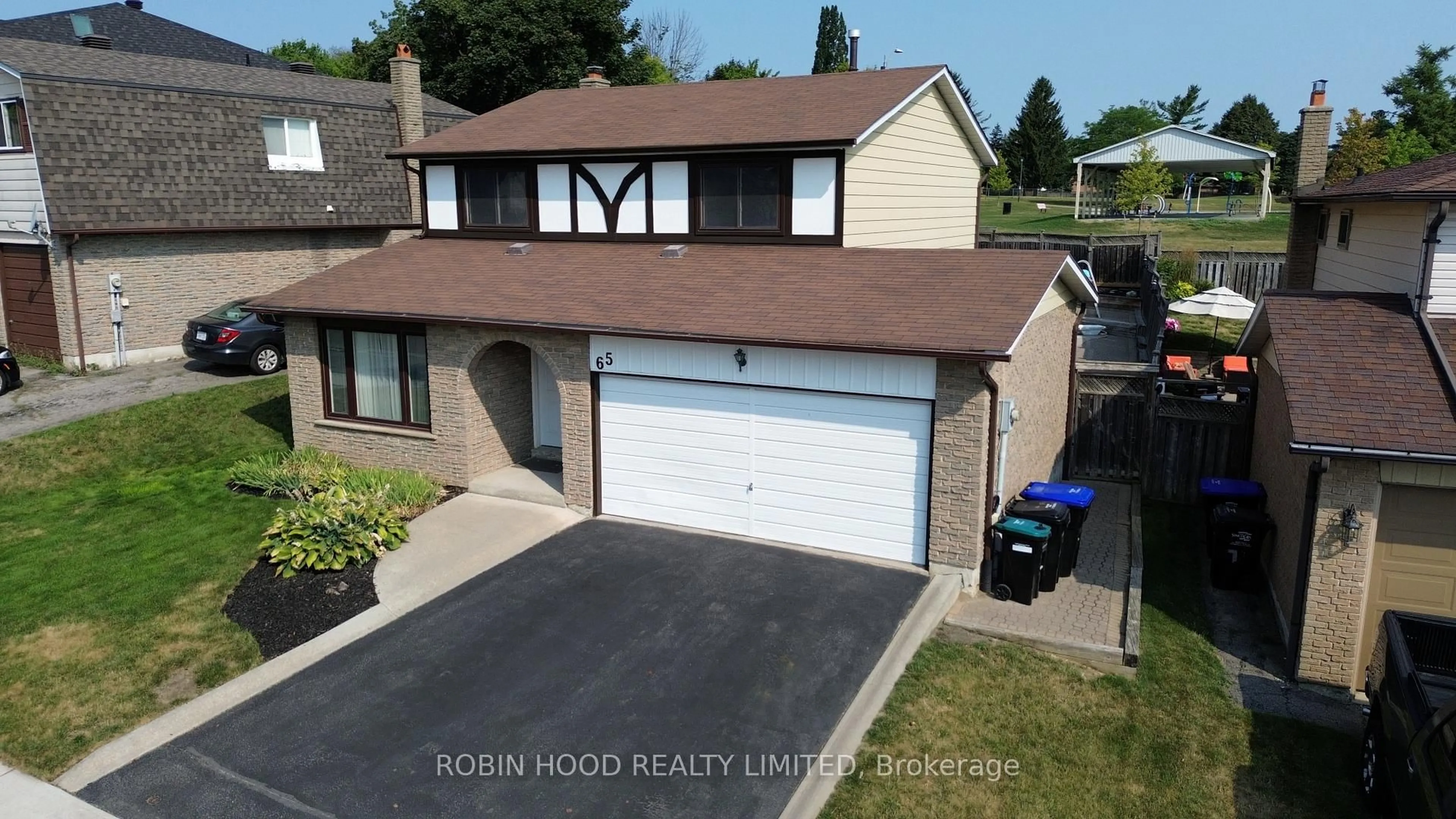 A pic from outside/outdoor area/front of a property/back of a property/a pic from drone, street for 65 Britannia Ave, Bradford West Gwillimbury Ontario L3Z 1A2