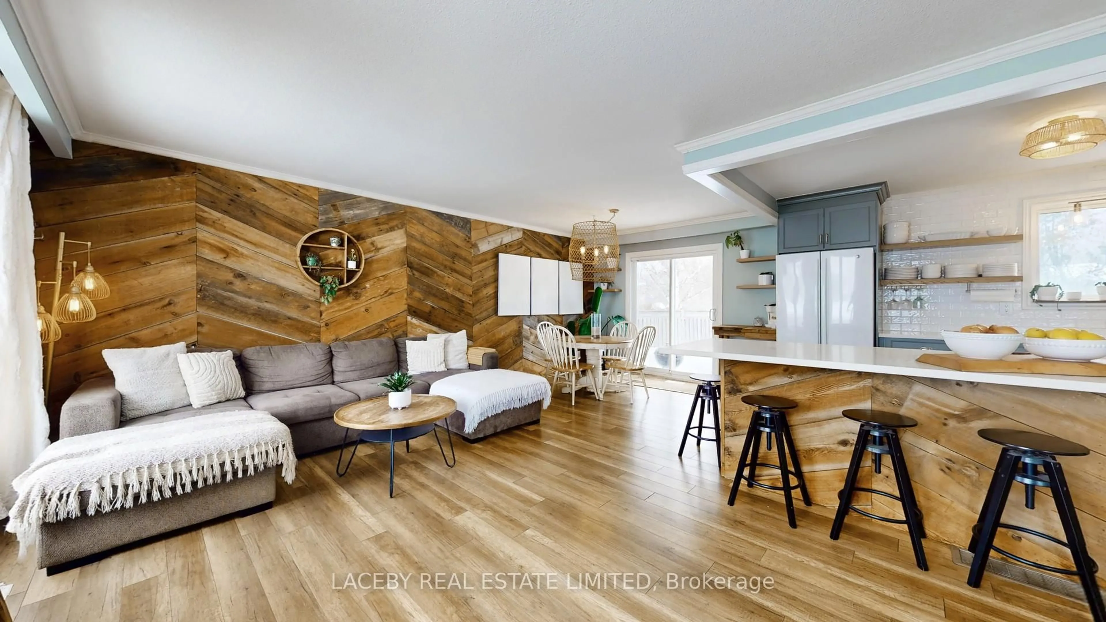 Living room with furniture, wood/laminate floor for 79 Douglas St, Georgina Ontario L0E 1R0