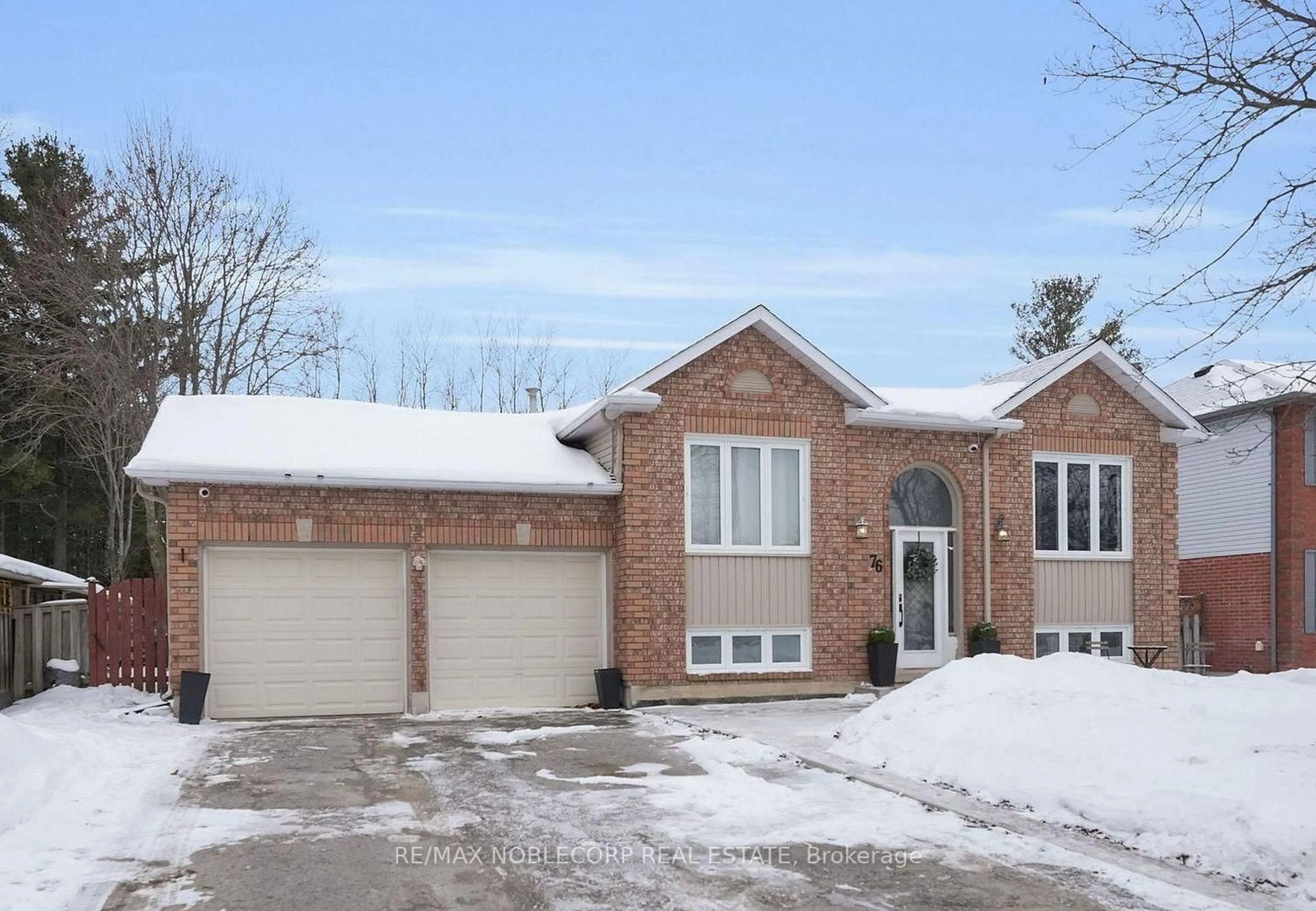 Home with brick exterior material, street for 76 Edenbridge Dr, Essa Ontario L3W 0K8