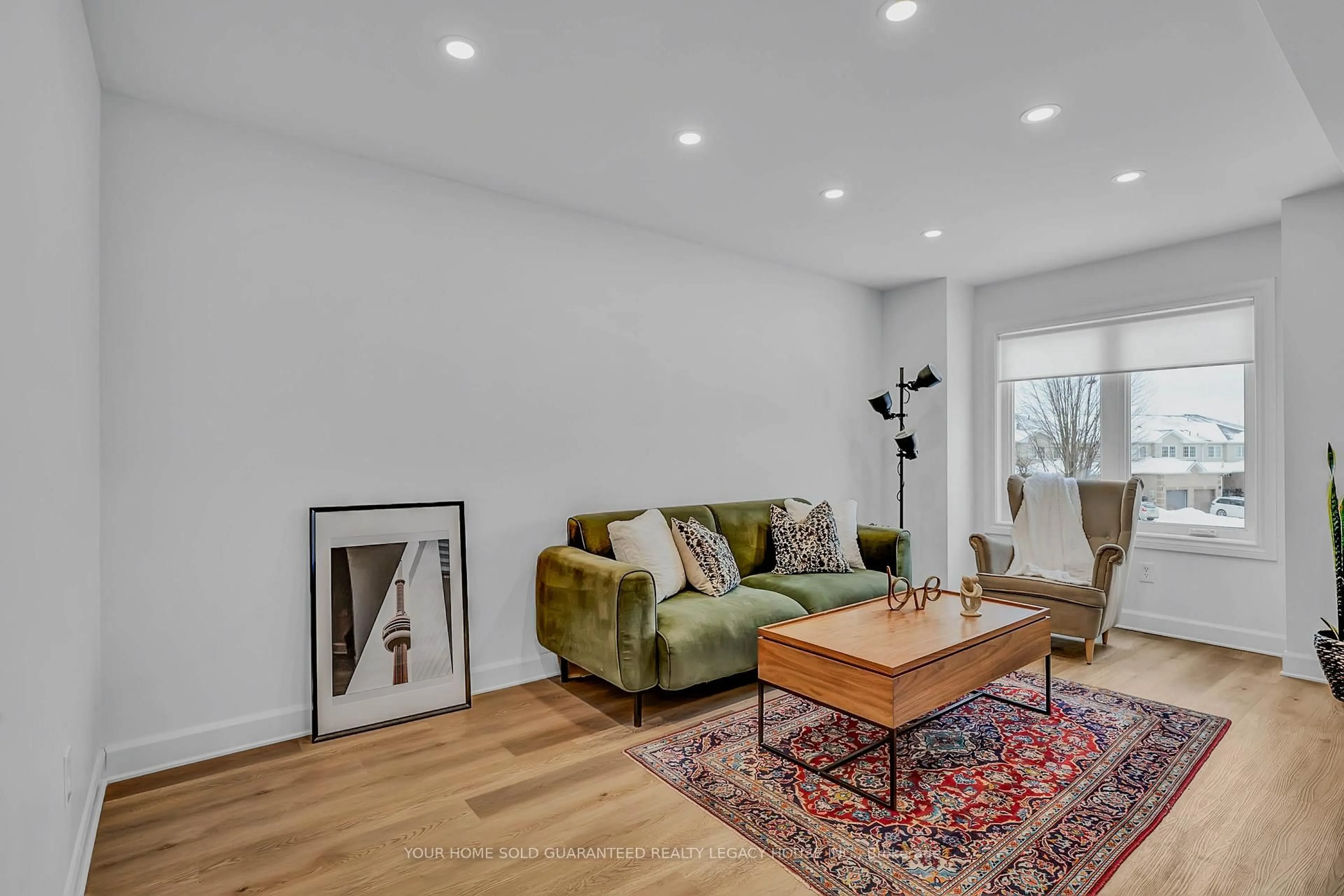 Living room with furniture, wood/laminate floor for 64 Natale Crt, Bradford West Gwillimbury Ontario L3Z 3B1