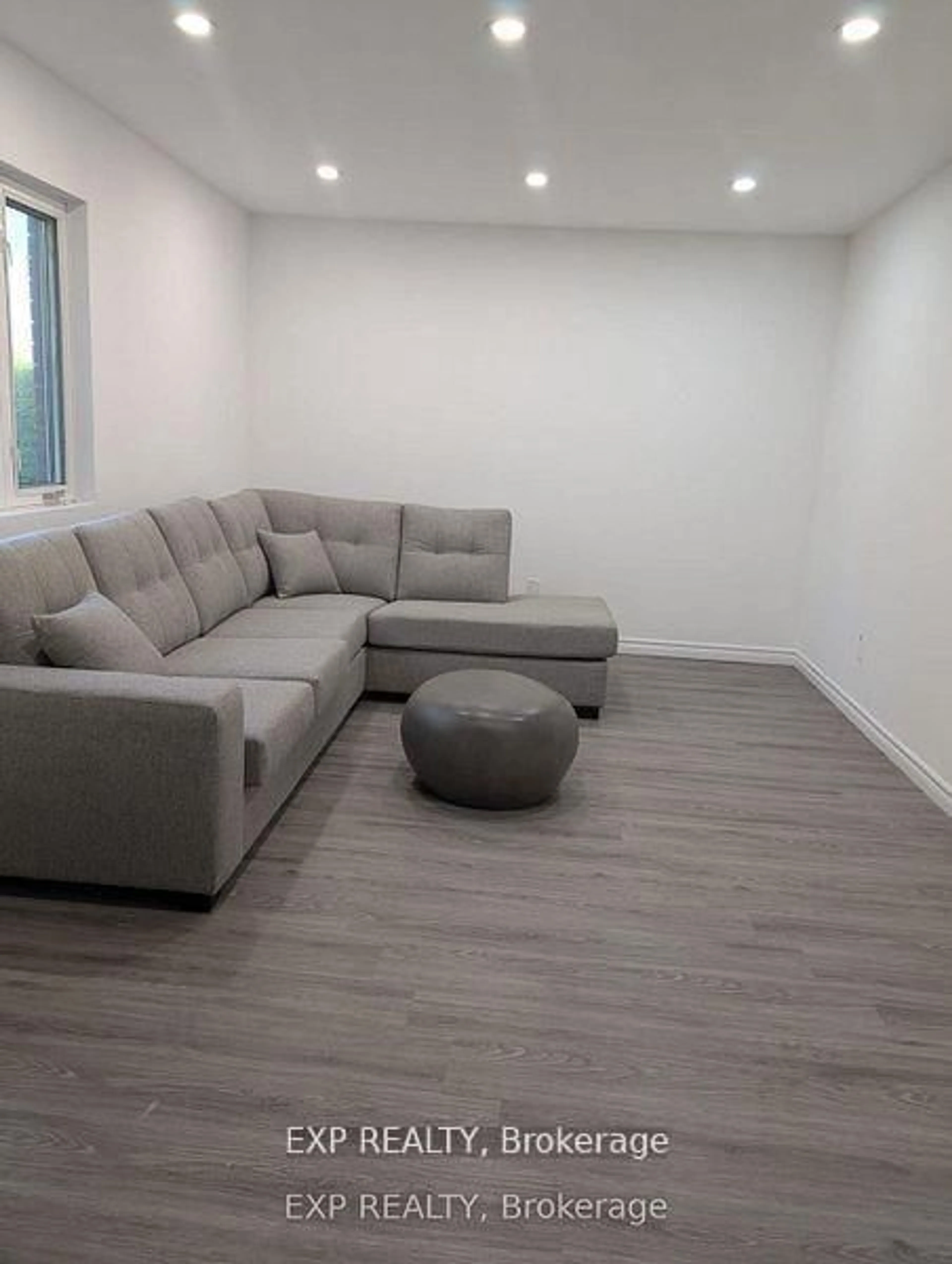 Living room with furniture, wood/laminate floor for 201 Garden Ave, Georgina Ontario L4P 2L3