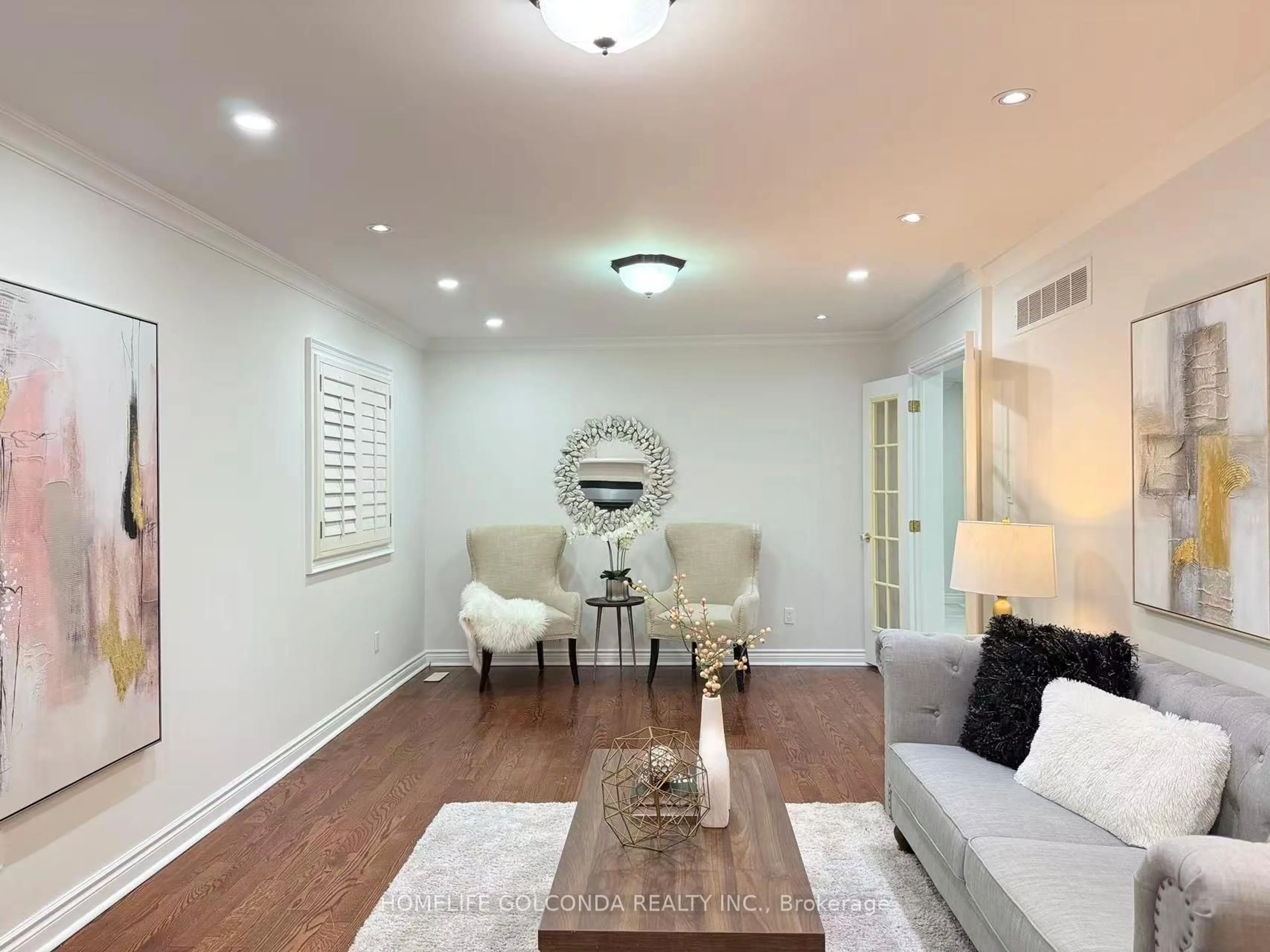 Living room with furniture, wood/laminate floor for 29 Randall Ave, Markham Ontario L3S 1J8