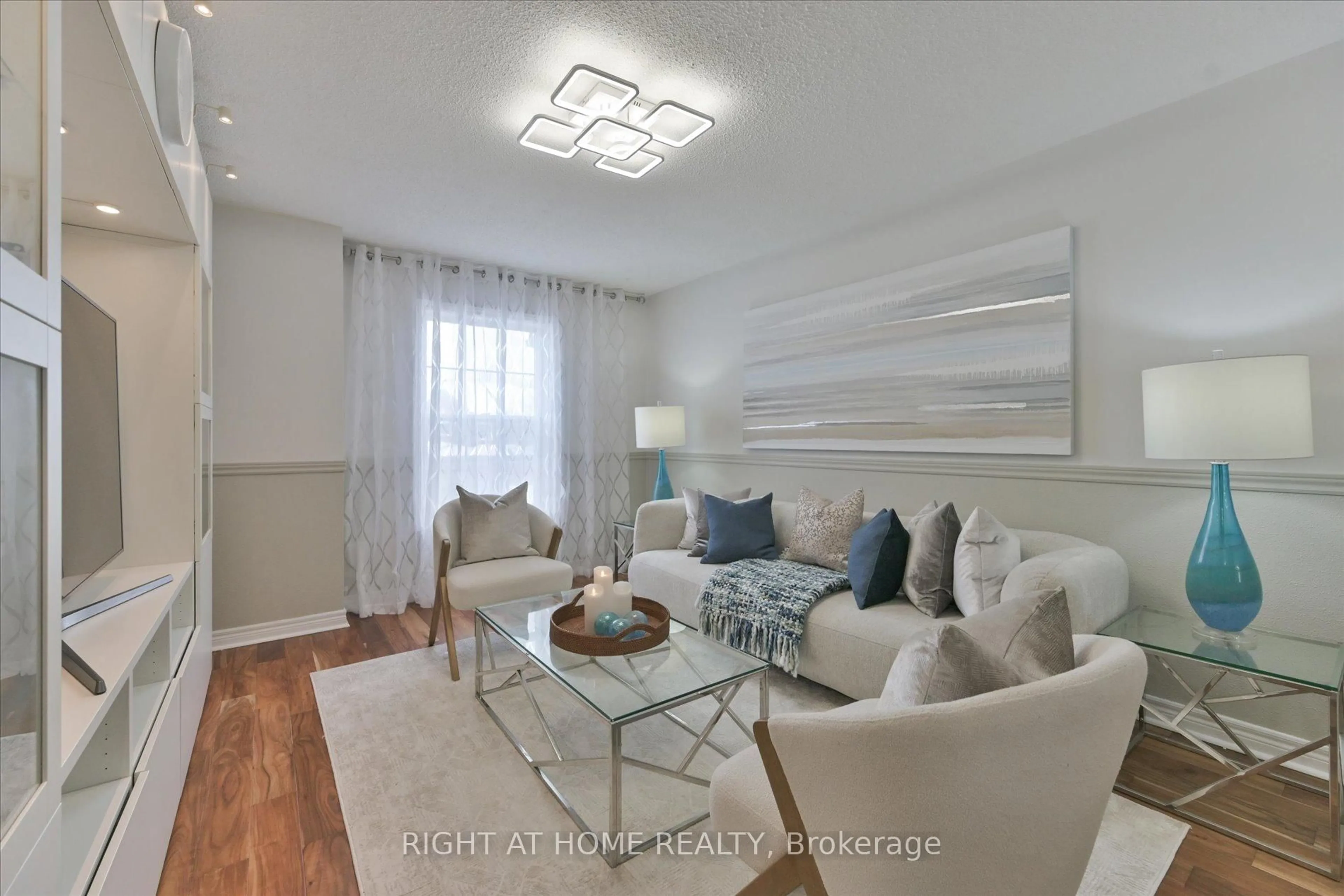 Living room with furniture, wood/laminate floor for 61 Milloy Pl, Aurora Ontario L4G 7L2