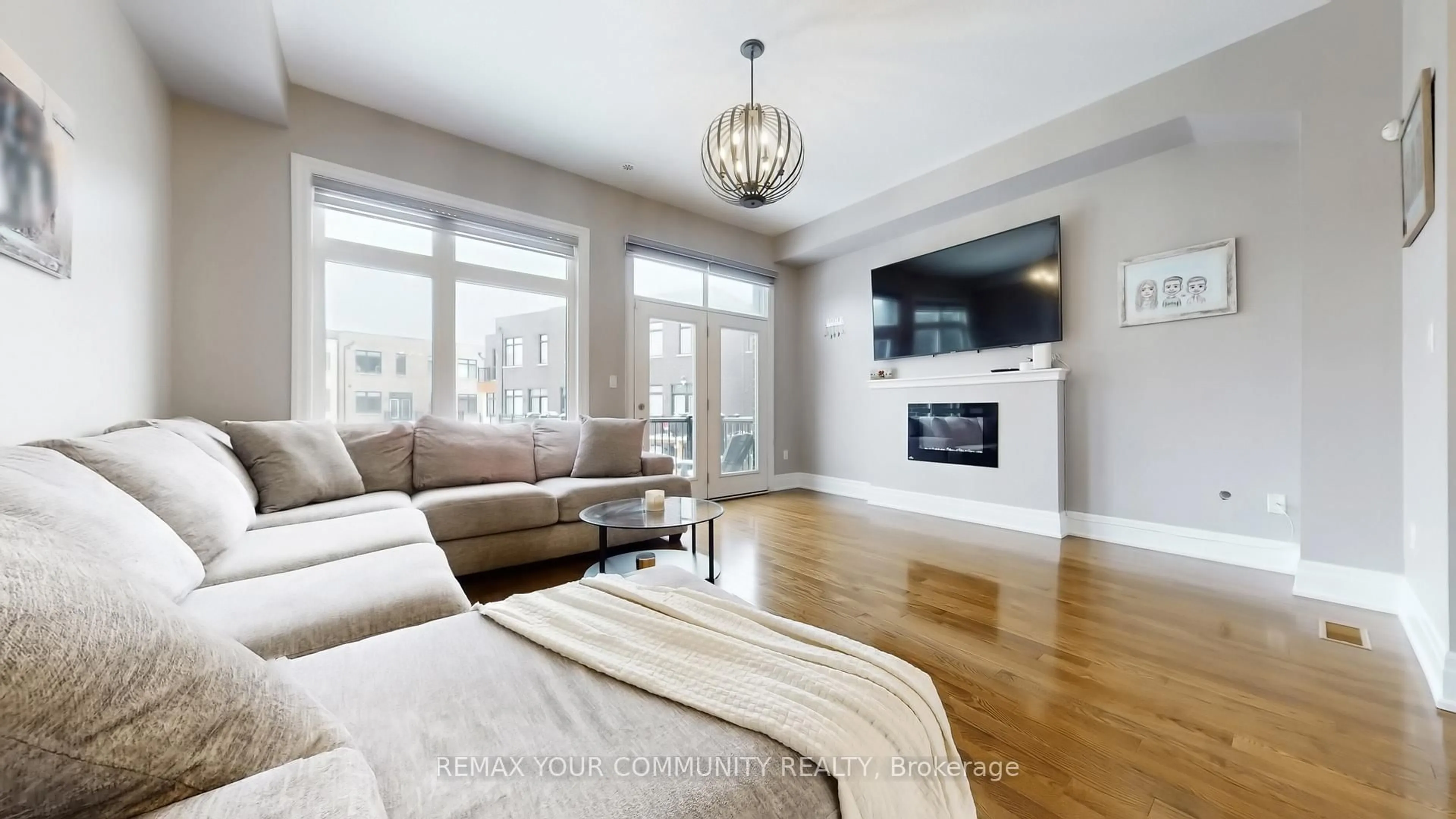 Living room with furniture, wood/laminate floor for 251 Thomas Cook Ave, Vaughan Ontario L6A 5A1