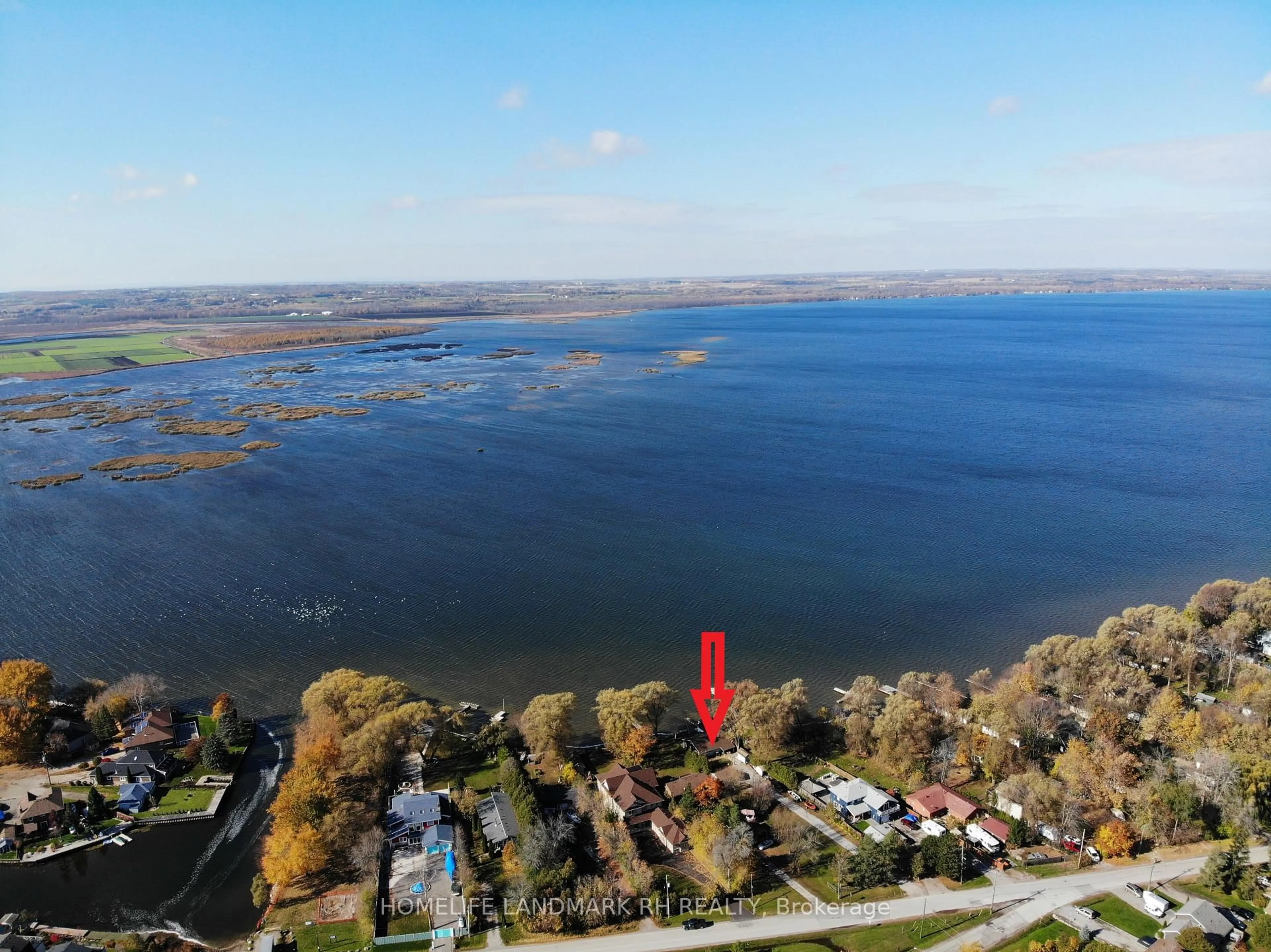 A pic from outside/outdoor area/front of a property/back of a property/a pic from drone, water/lake/river/ocean view for 586 Lake Dr, Georgina Ontario L4P 1T3