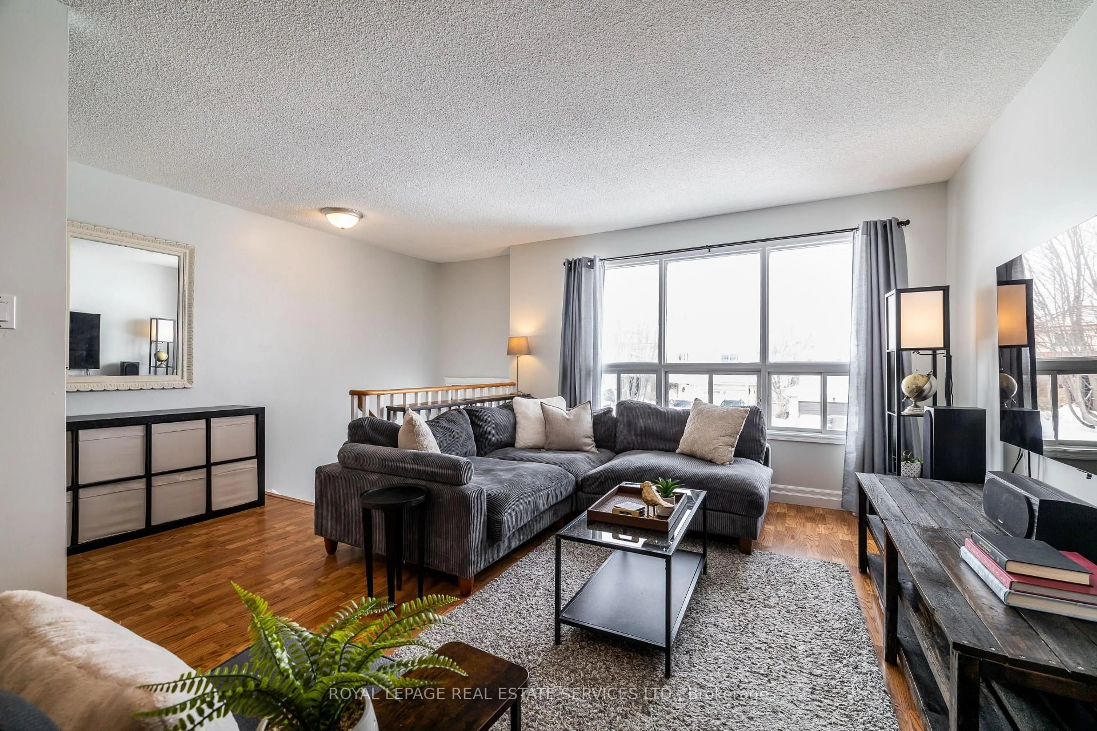 Living room with furniture, wood/laminate floor for 457 Britannia Ave, Bradford West Gwillimbury Ontario L3Z 2C8