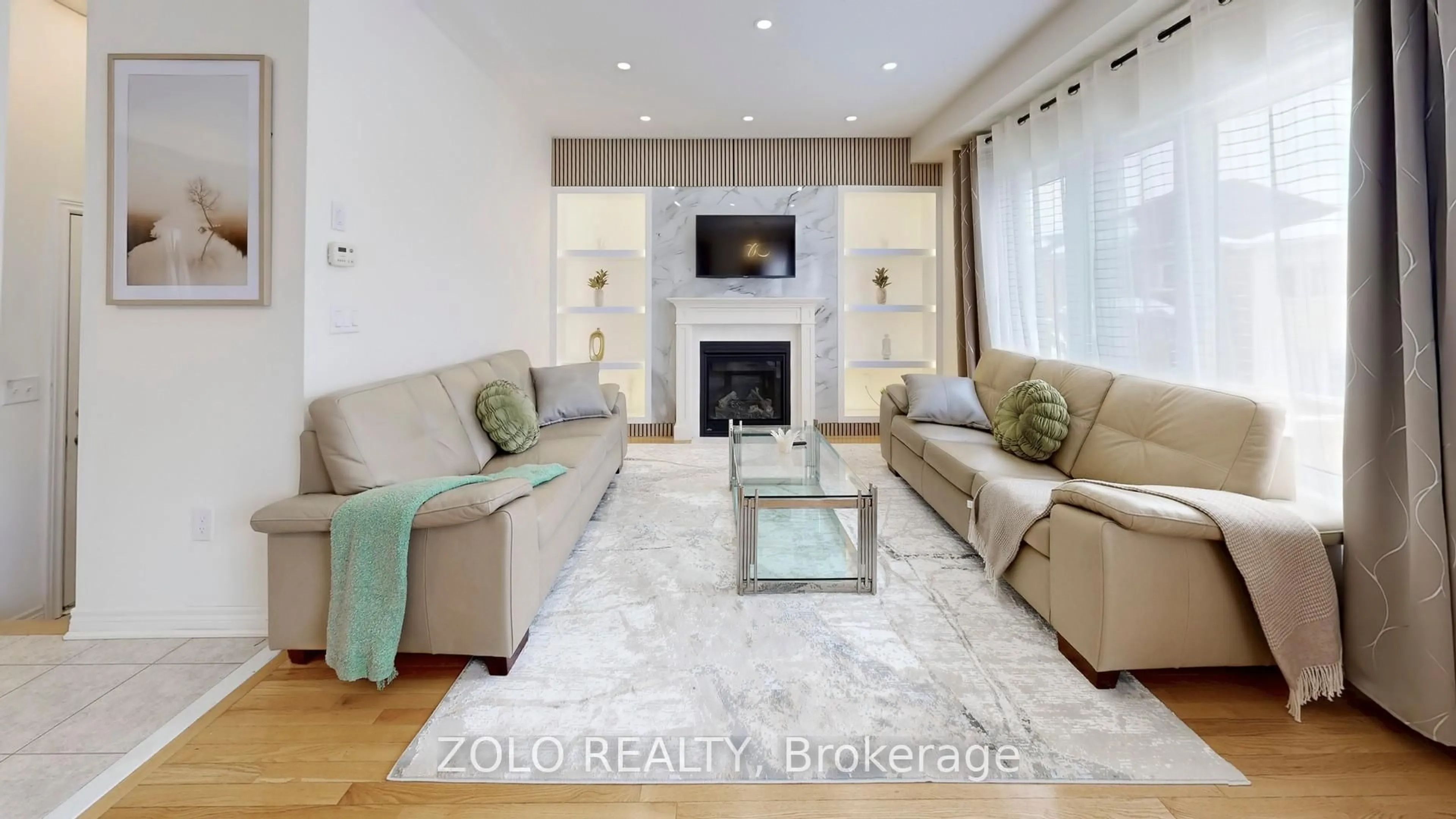 Living room with furniture, wood/laminate floor for 42 Foxberry Rd, East Gwillimbury Ontario L9N 0P6