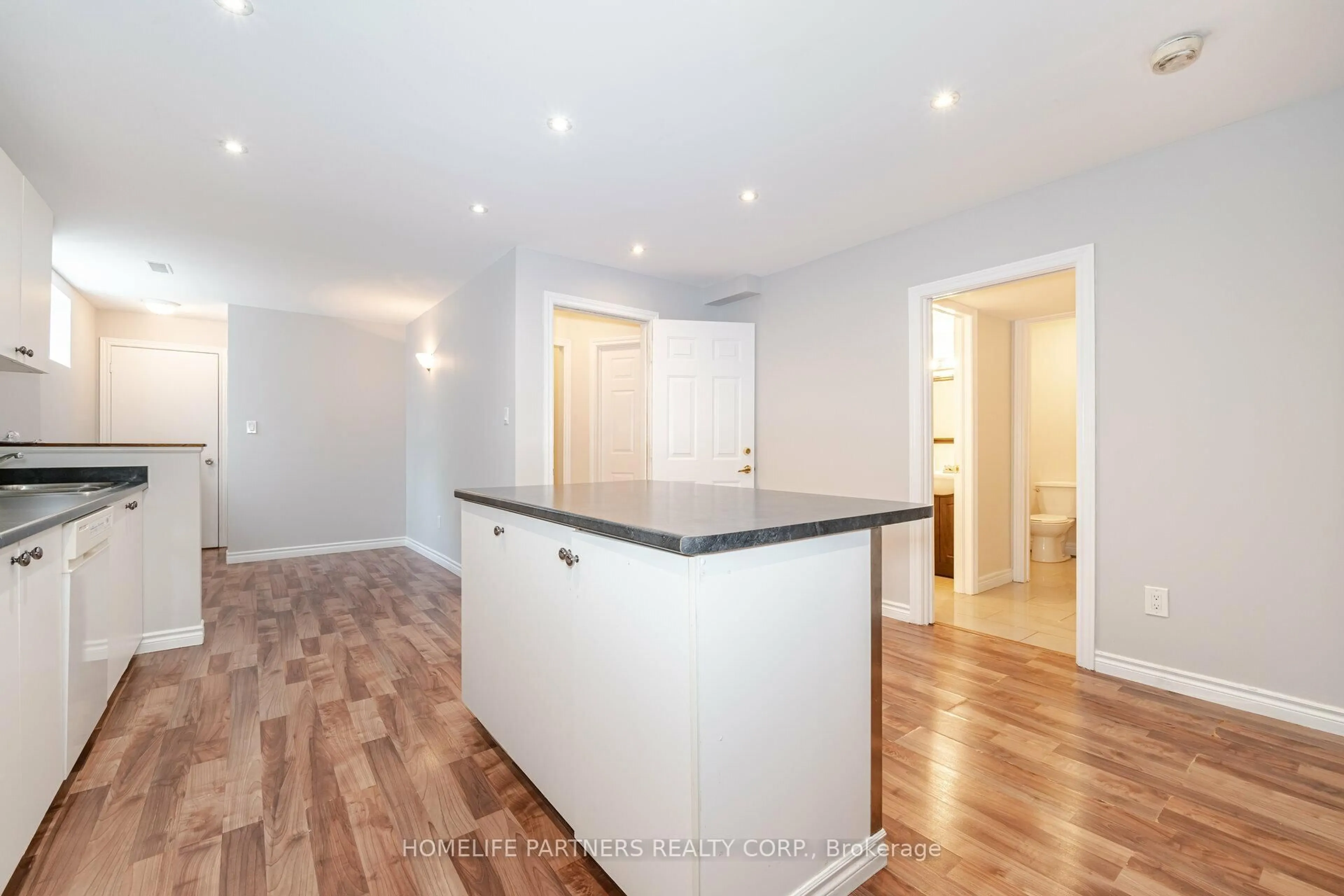 Open concept kitchen, wood/laminate floor for 7930 Kipling Ave, Vaughan Ontario L4L 1Z5