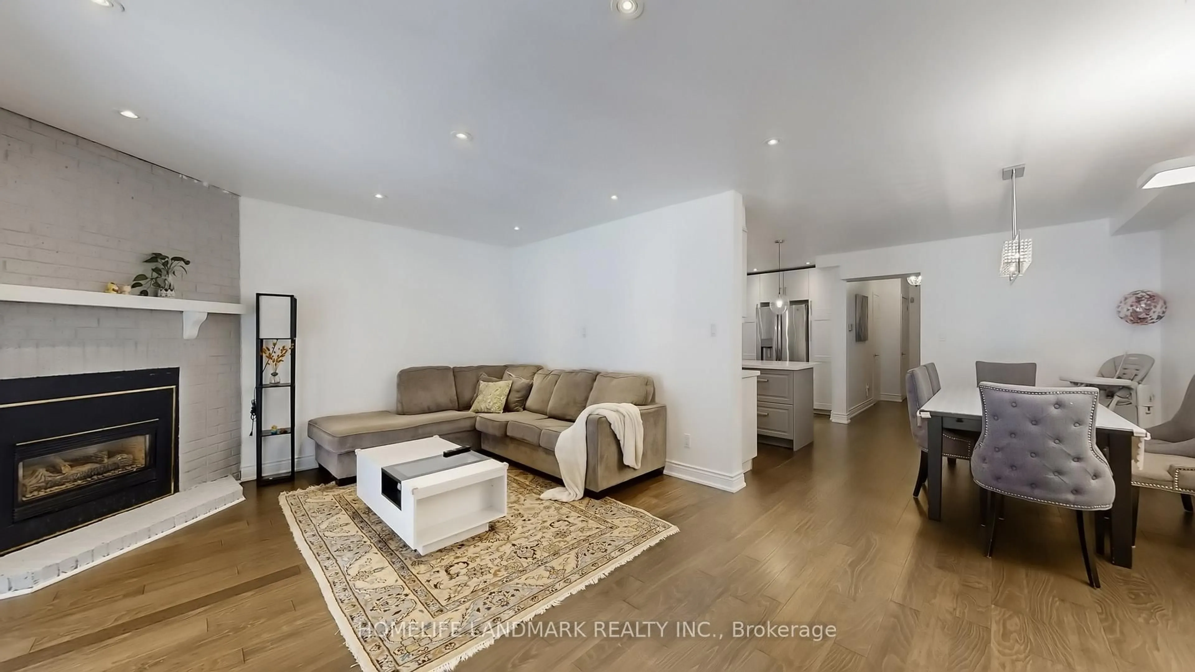 Living room with furniture, wood/laminate floor for 81 Stirling Cres, Markham Ontario L3R 7J8