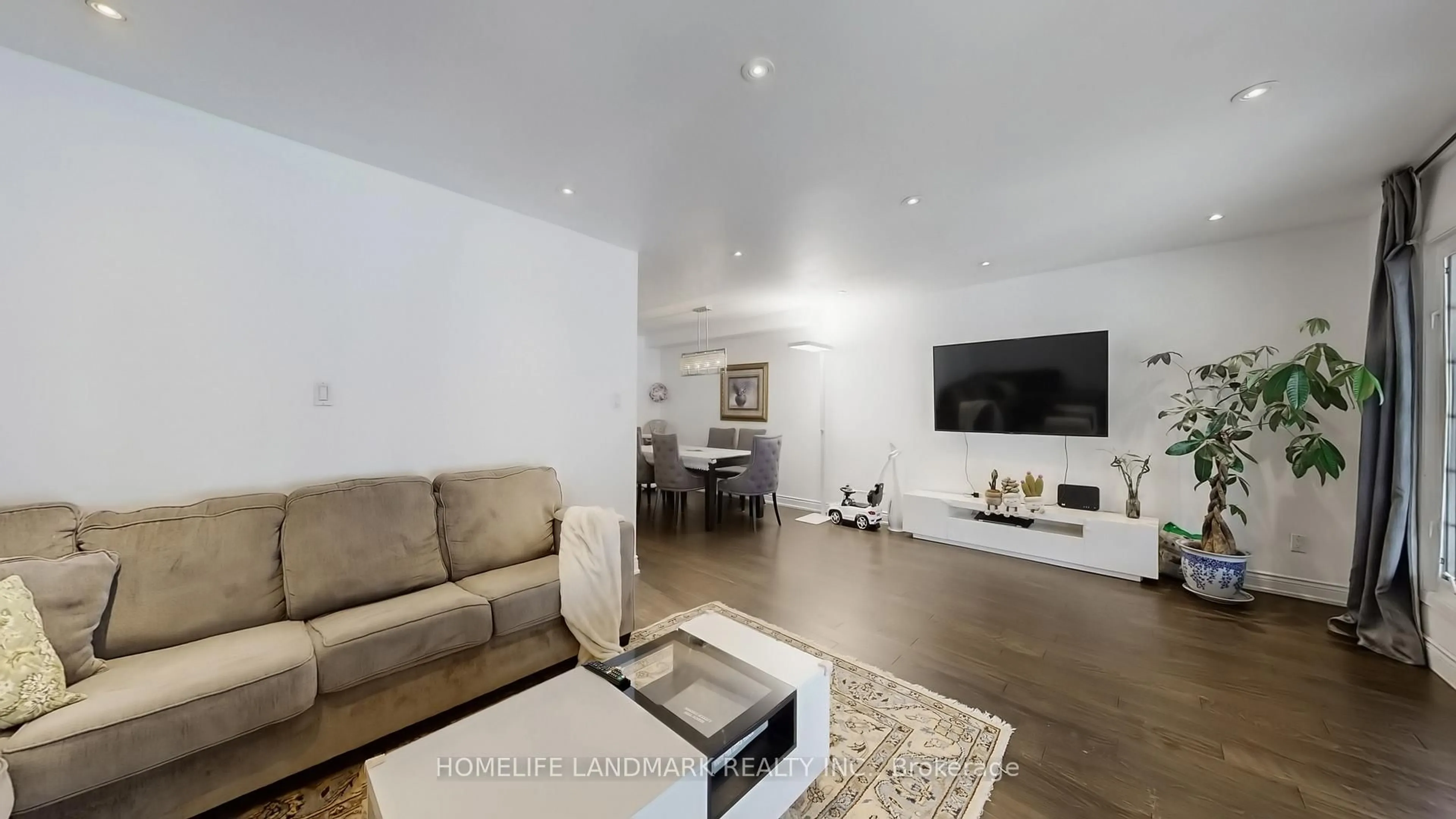 Living room with furniture, wood/laminate floor for 81 Stirling Cres, Markham Ontario L3R 7J8