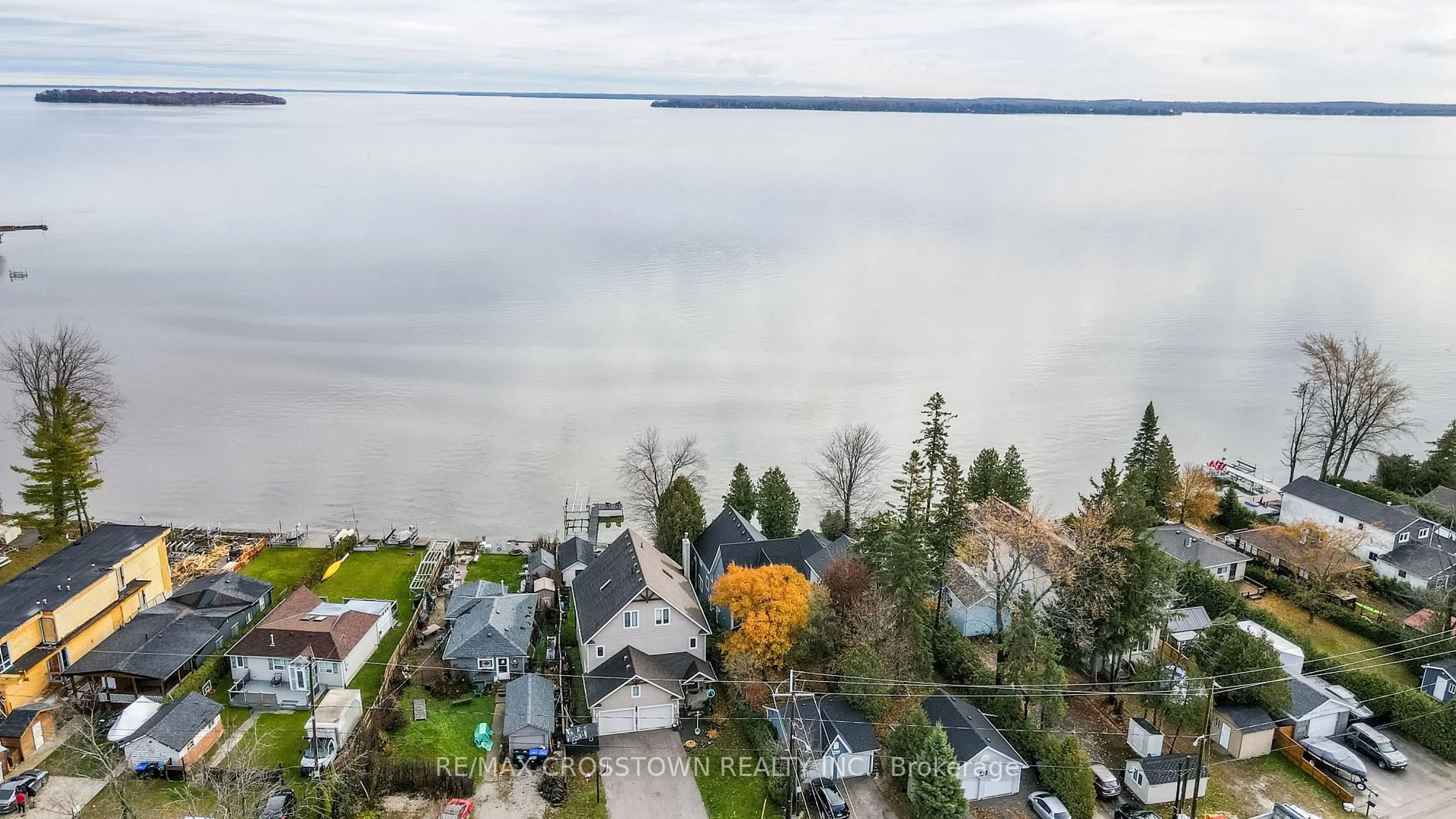 A pic from outside/outdoor area/front of a property/back of a property/a pic from drone, water/lake/river/ocean view for 2325 Crystal Beach Rd, Innisfil Ontario L9S 3W8