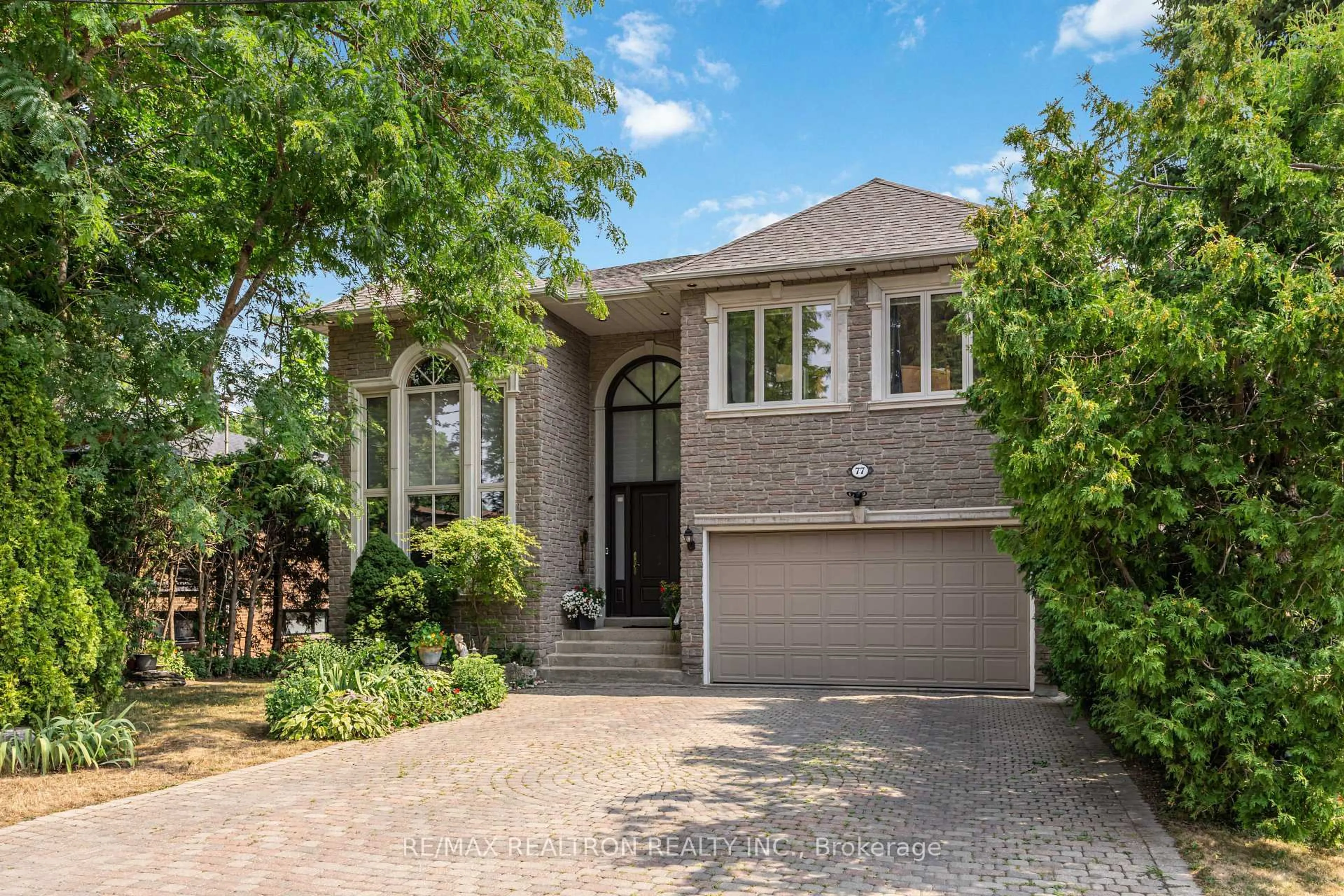 Home with brick exterior material, street for 77 Sprucewood Dr, Markham Ontario L3T 2P9
