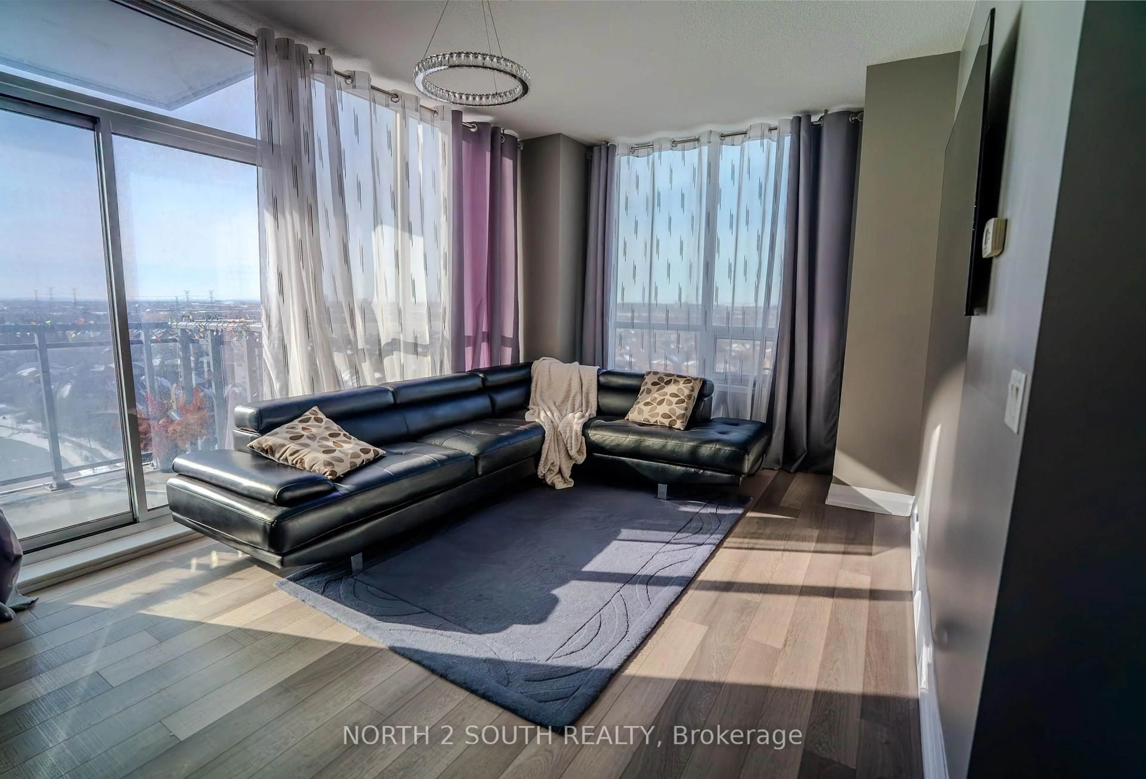 Living room with furniture, wood/laminate floor for 85 North Park Rd #1012, Vaughan Ontario L4J 0H9