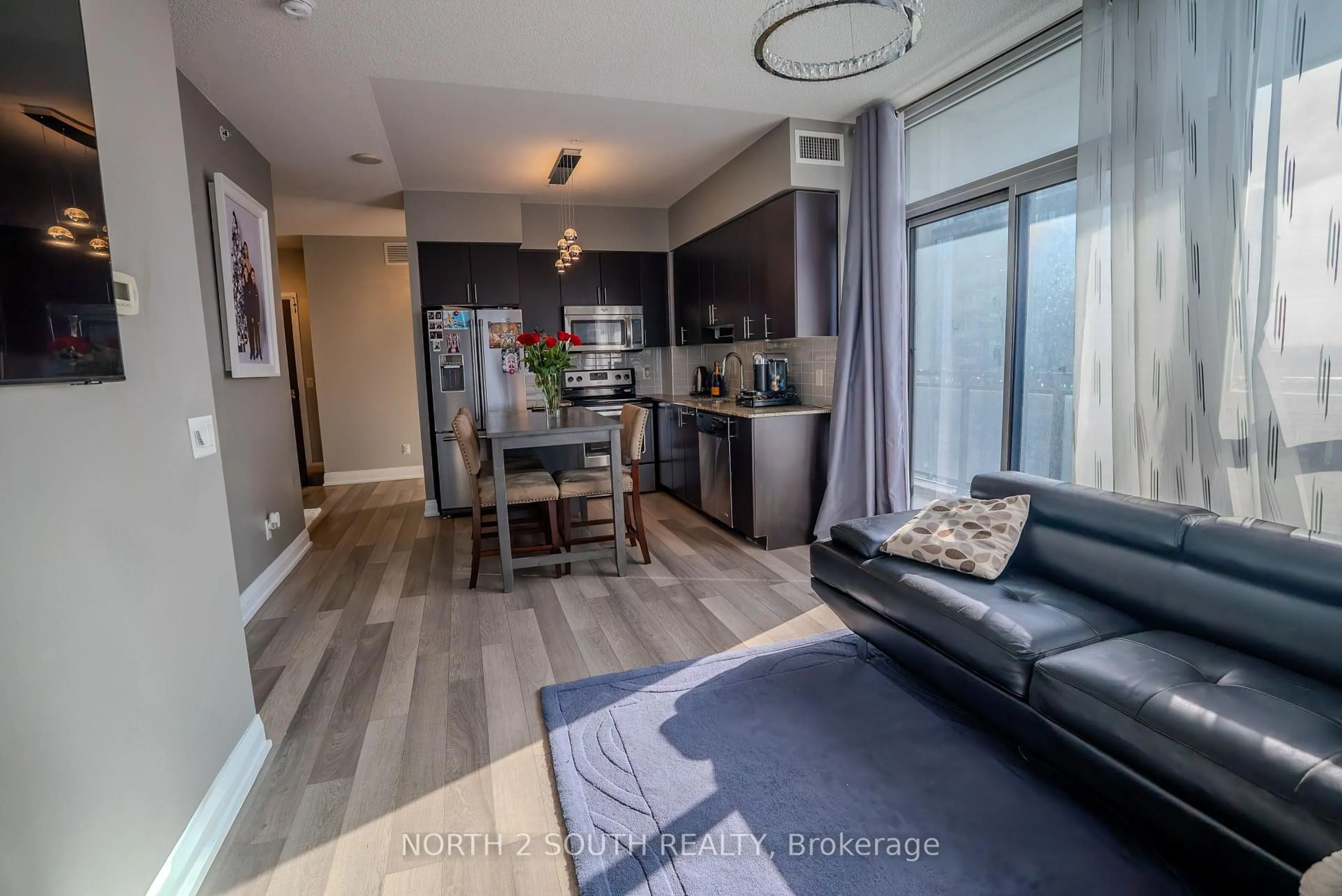 Living room with furniture, wood/laminate floor for 85 North Park Rd #1012, Vaughan Ontario L4J 0H9
