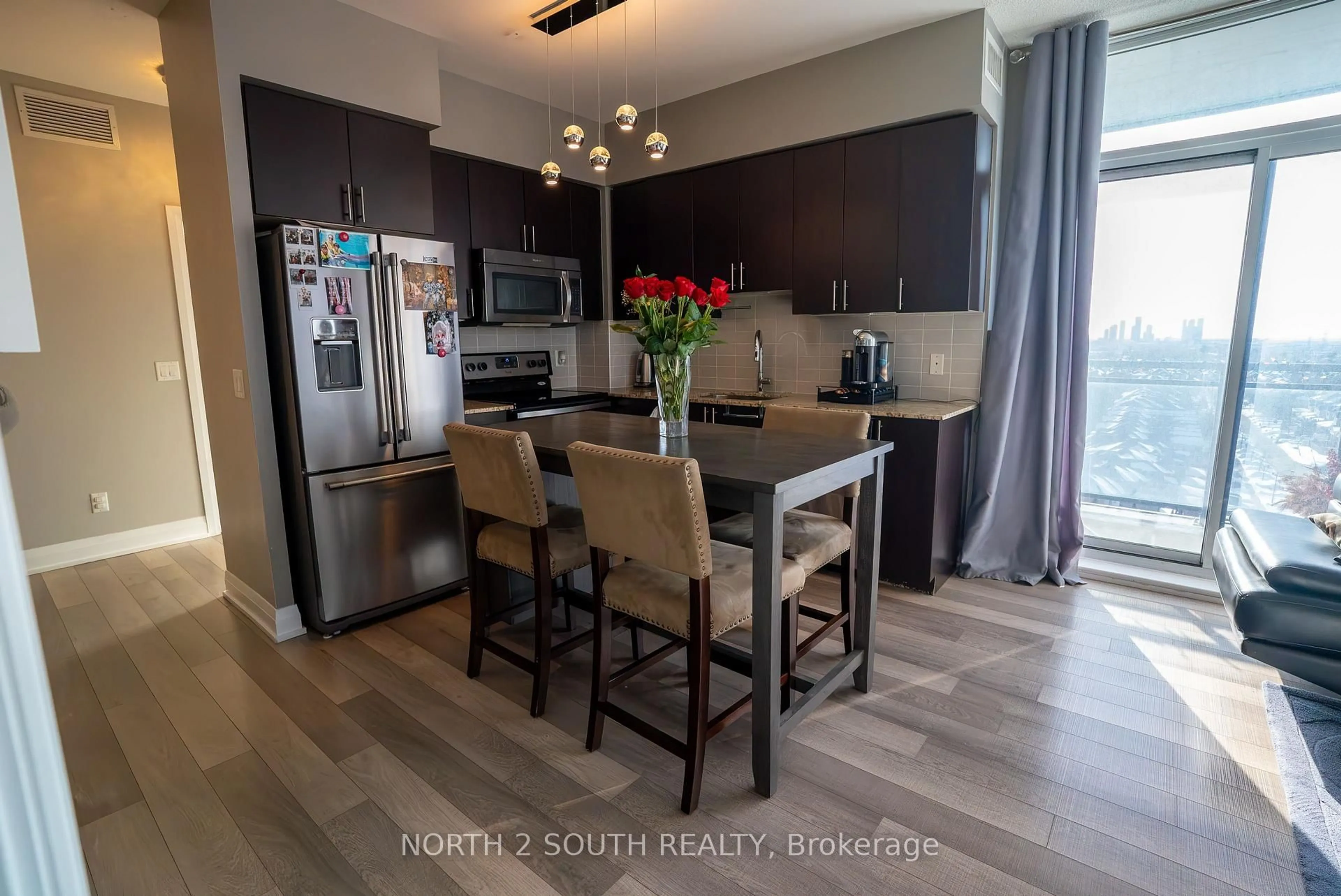 Open concept kitchen, wood/laminate floor for 85 North Park Rd #1012, Vaughan Ontario L4J 0H9