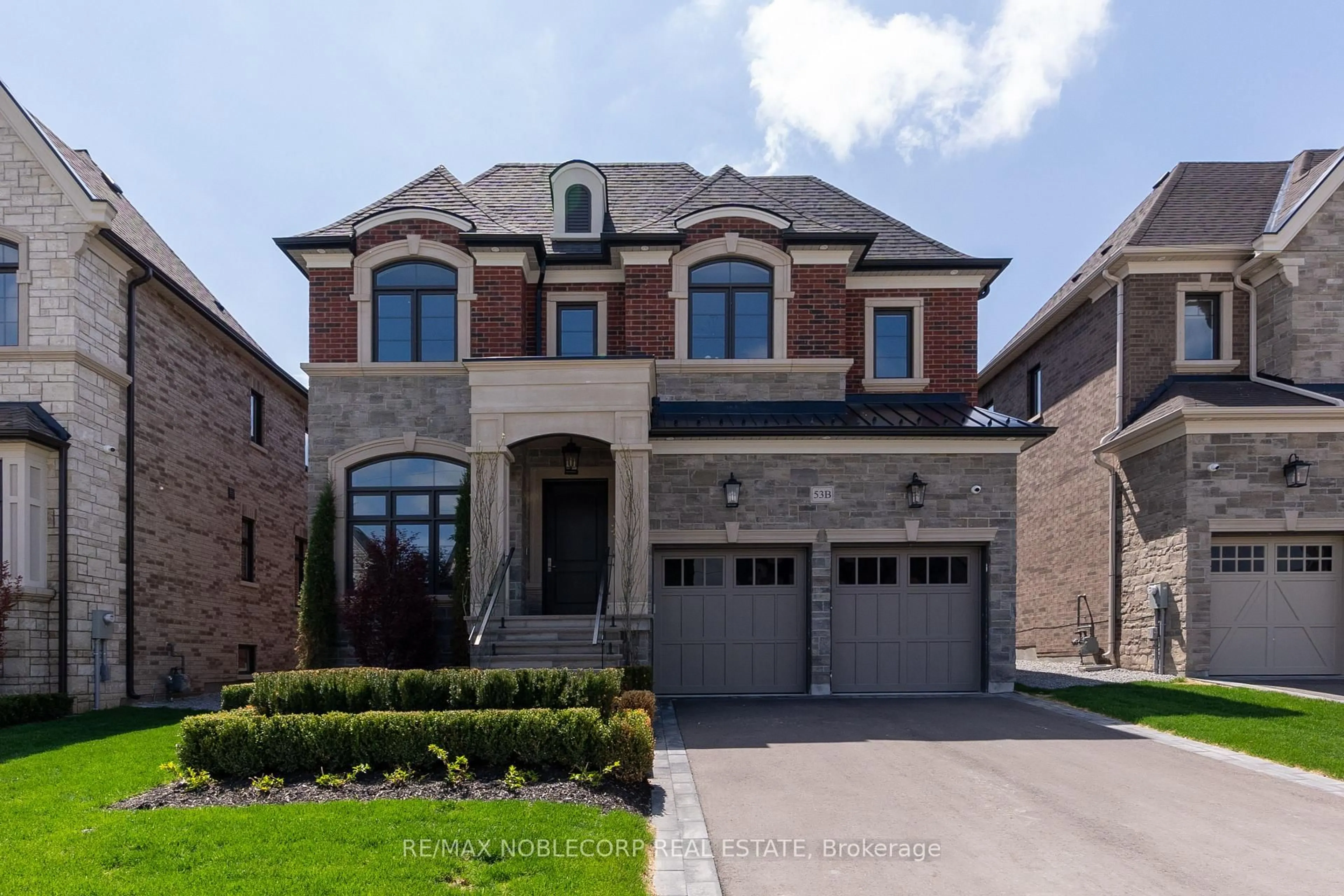 Home with brick exterior material, street for 53B Puccini Dr, Richmond Hill Ontario L4E 2Y7
