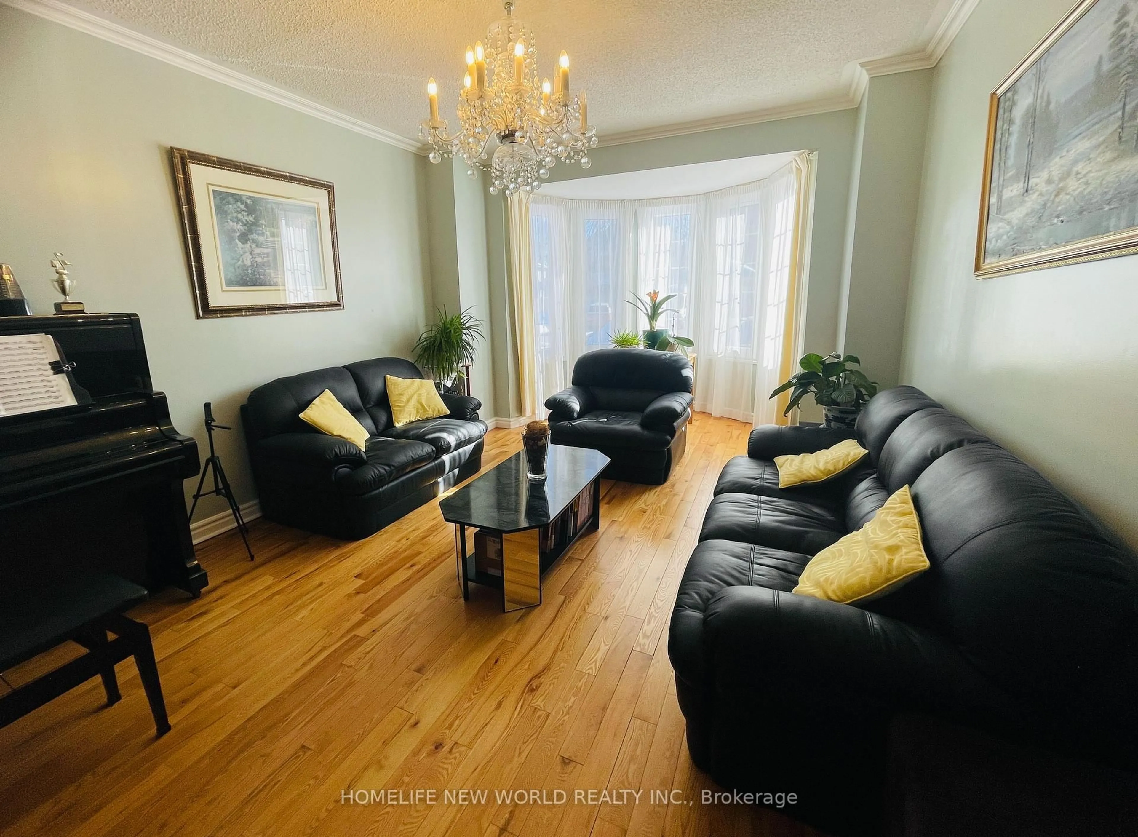 Living room with furniture, wood/laminate floor for 32 Halstead Dr, Markham Ontario L3R 7Z7