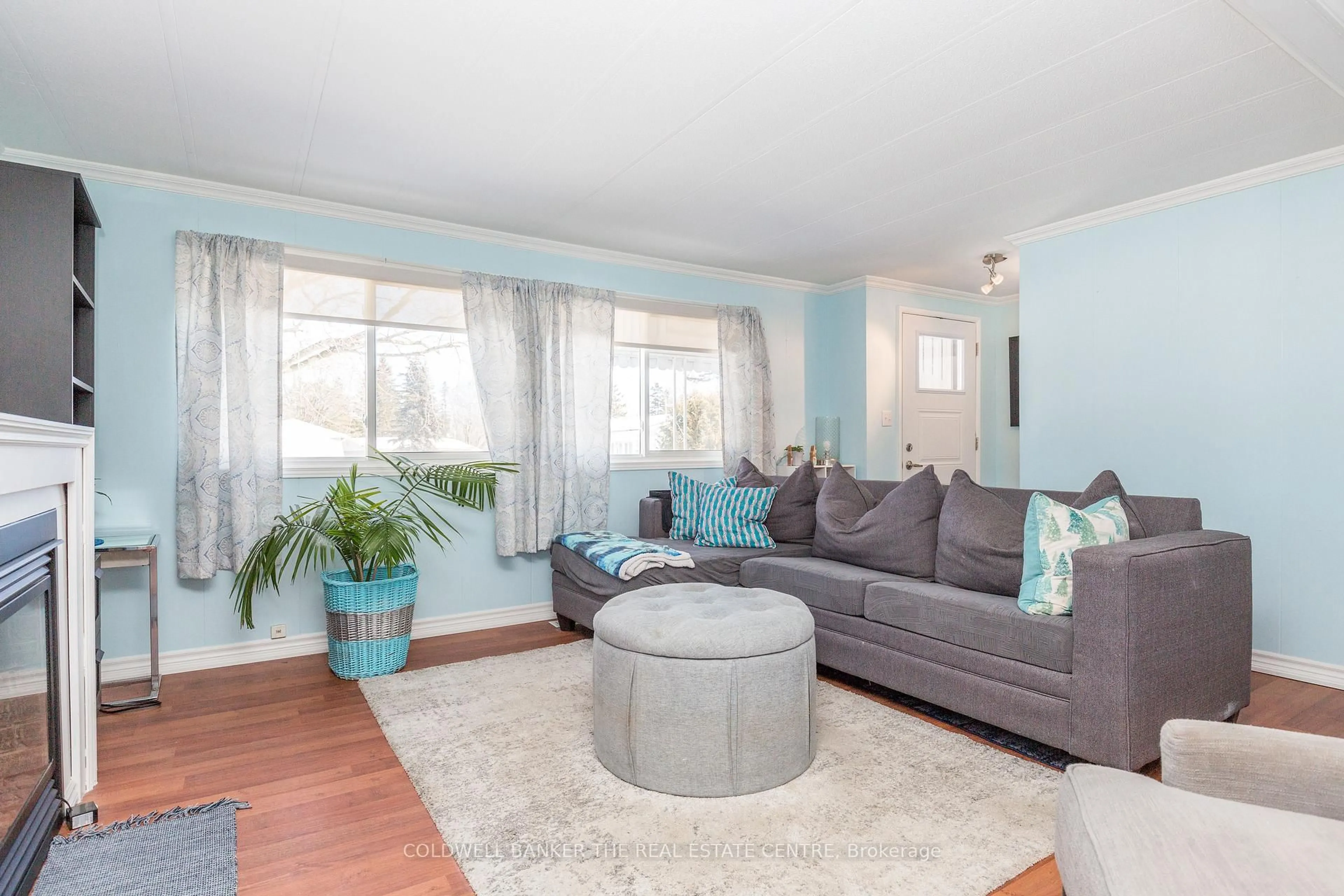 Living room with furniture, wood/laminate floor for 5 Broadway Ave, Innisfil Ontario L9S 1M9