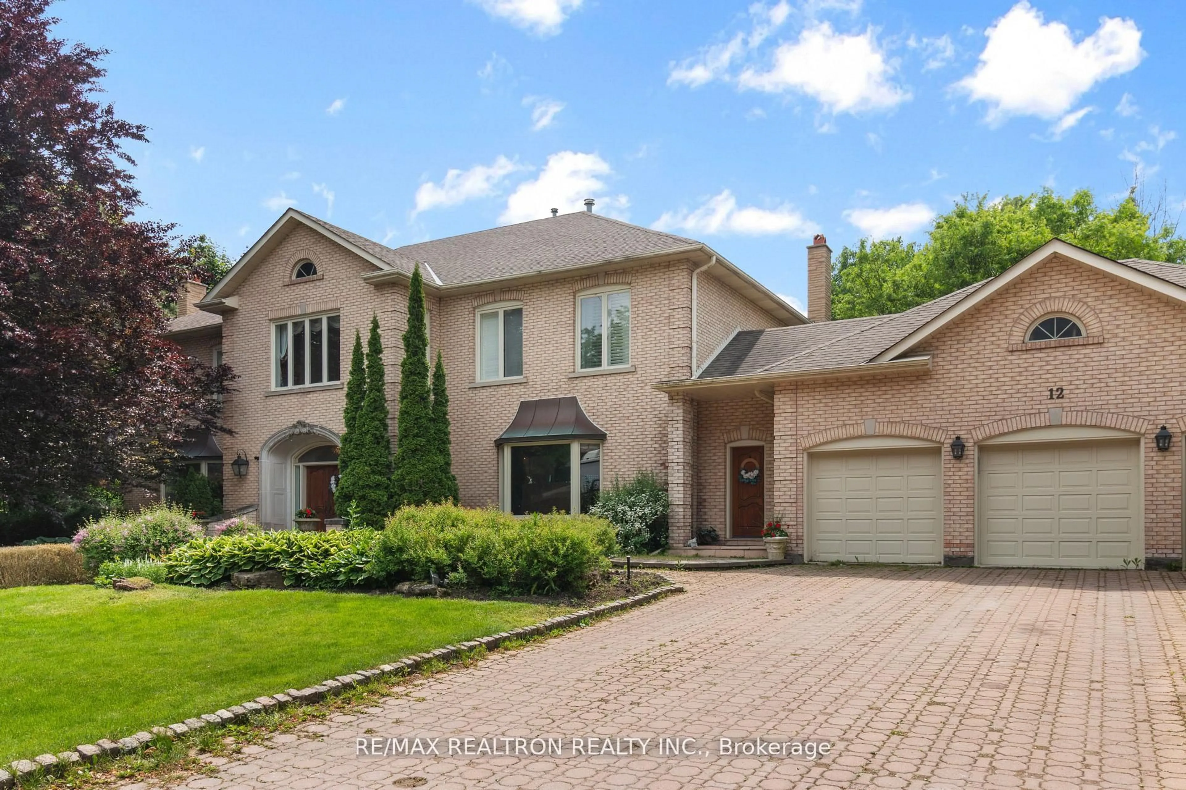 Home with brick exterior material, street for 12 Moodie Dr, Richmond Hill Ontario L4C 8C9