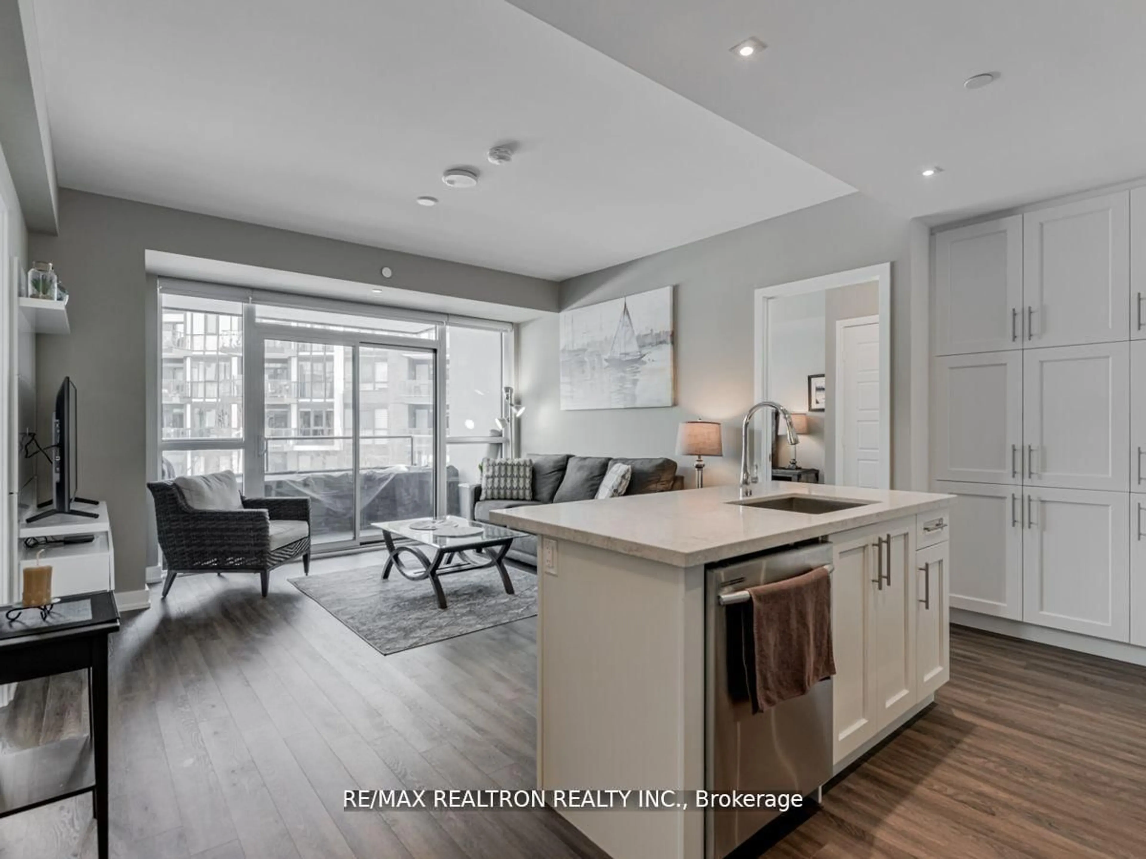 Open concept kitchen, wood/laminate floor for 375 Sea Ray Ave #229, Innisfil Ontario L9S 0N9