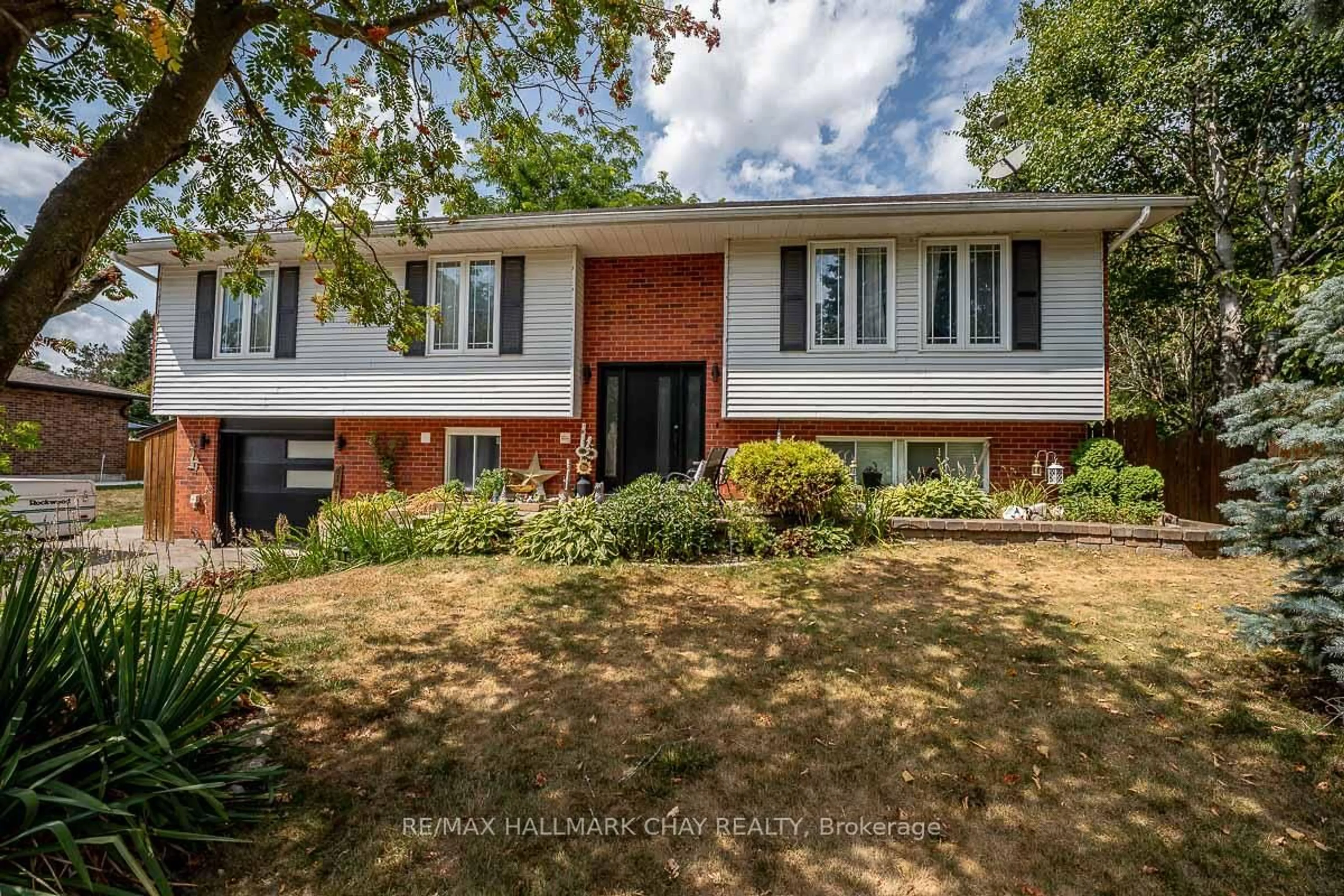 Home with brick exterior material, street for 61 Marshall Cres, Essa Ontario L0M 1B1