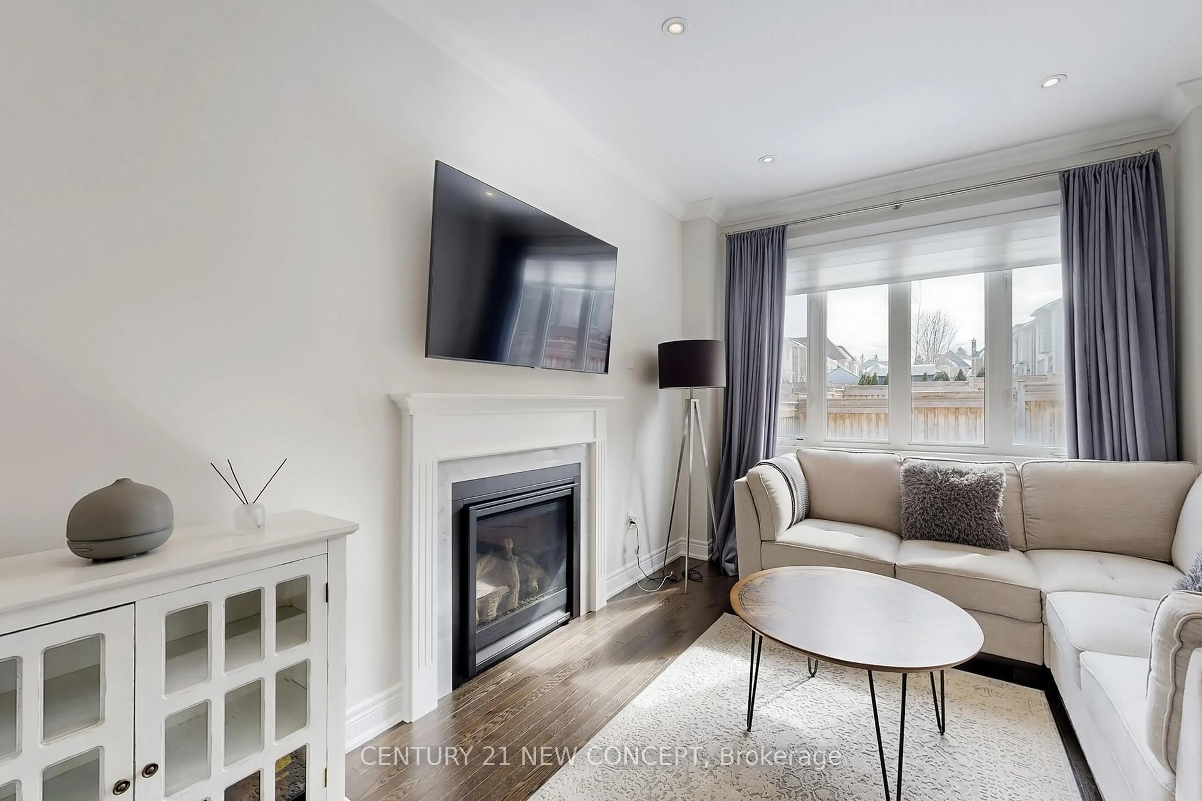 Living room with furniture, wood/laminate floor for 622 Sweetwater Cres, Newmarket Ontario L3X 0H5