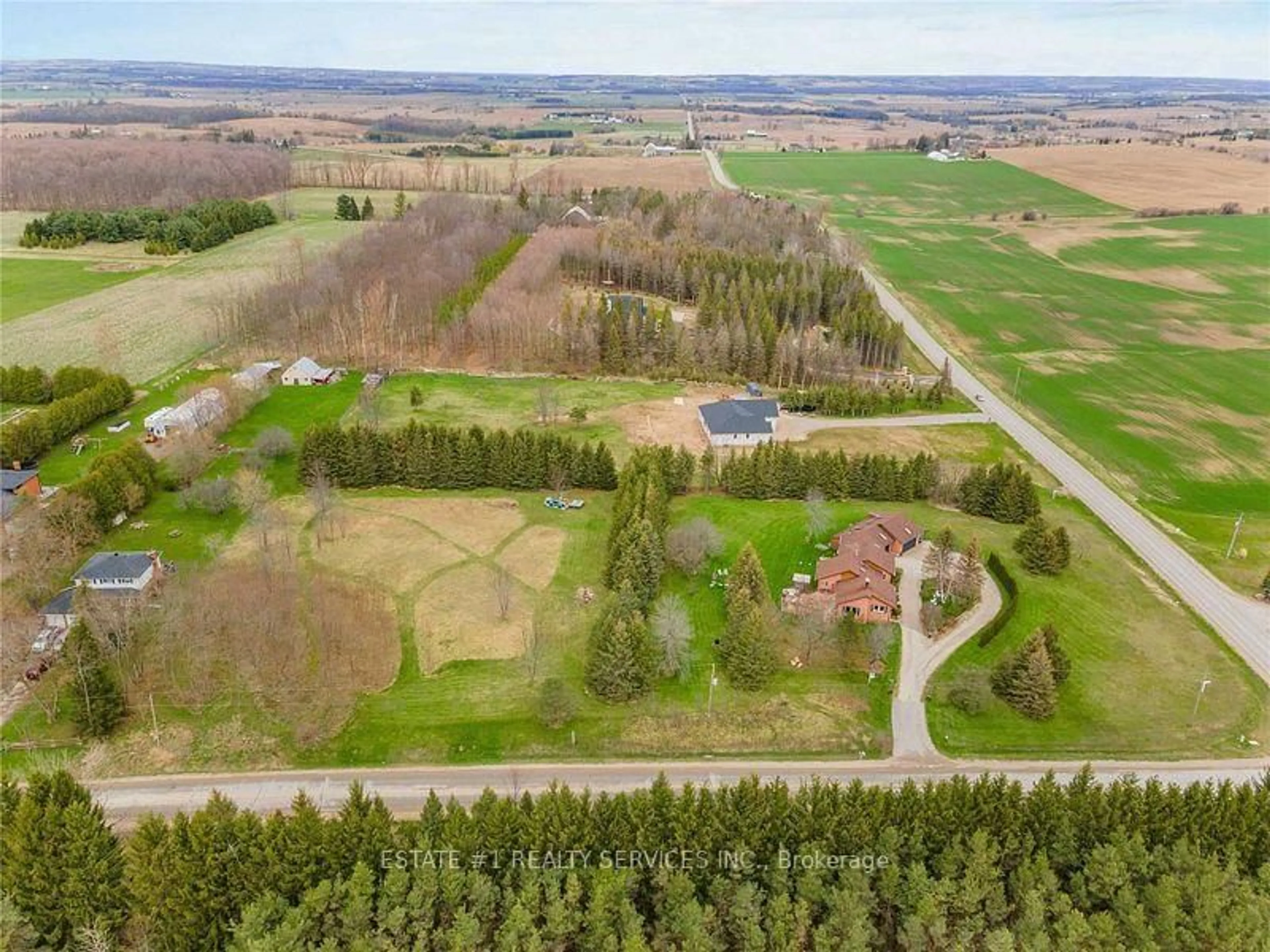 A pic from outside/outdoor area/front of a property/back of a property/a pic from drone, forest/trees view for 5464 6th Line, New Tecumseth Ontario L0G 1W0