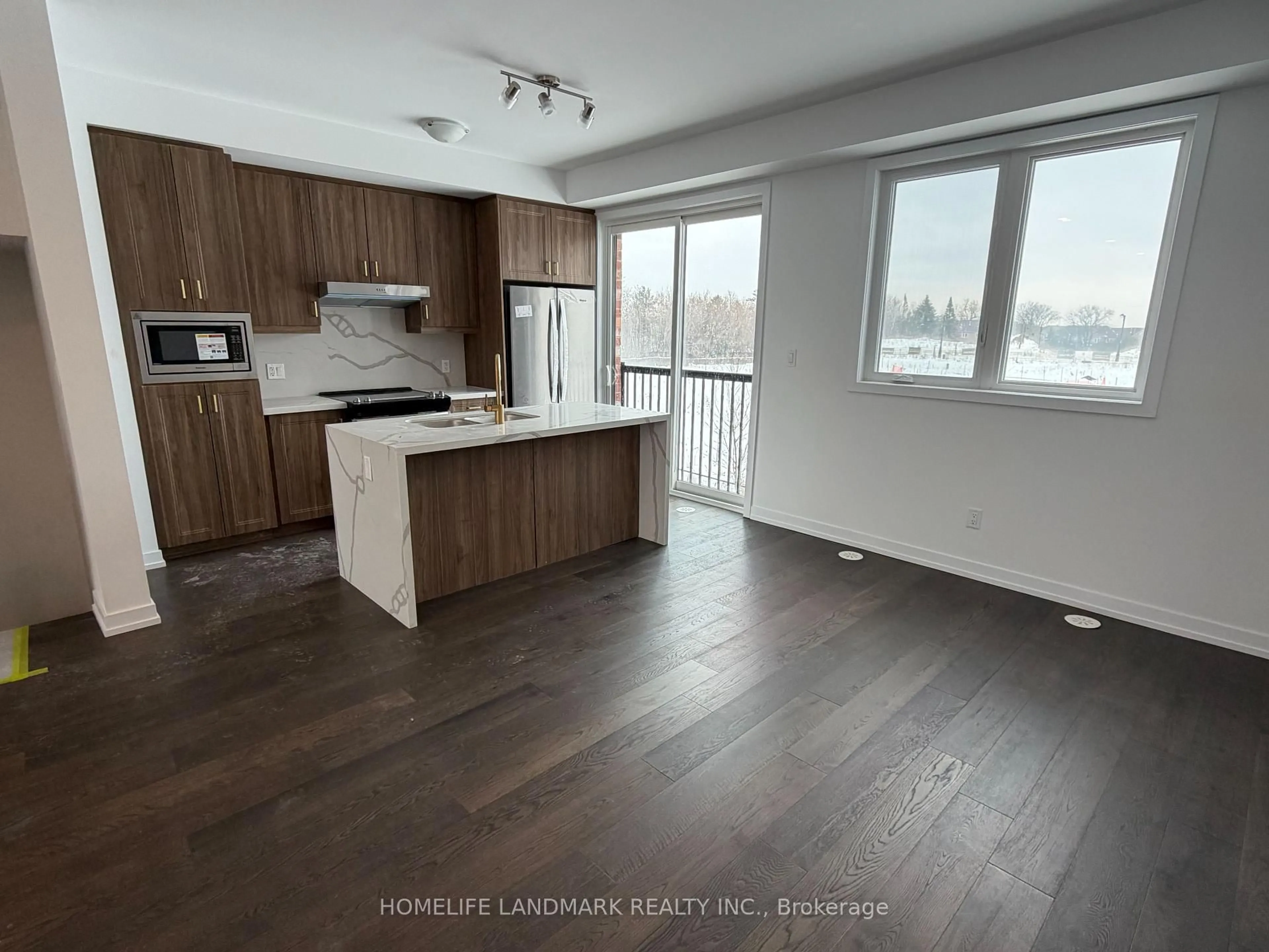 Open concept kitchen, wood/laminate floor for 29 Bancroft Lane, Richmond Hill Ontario L4E 1M1