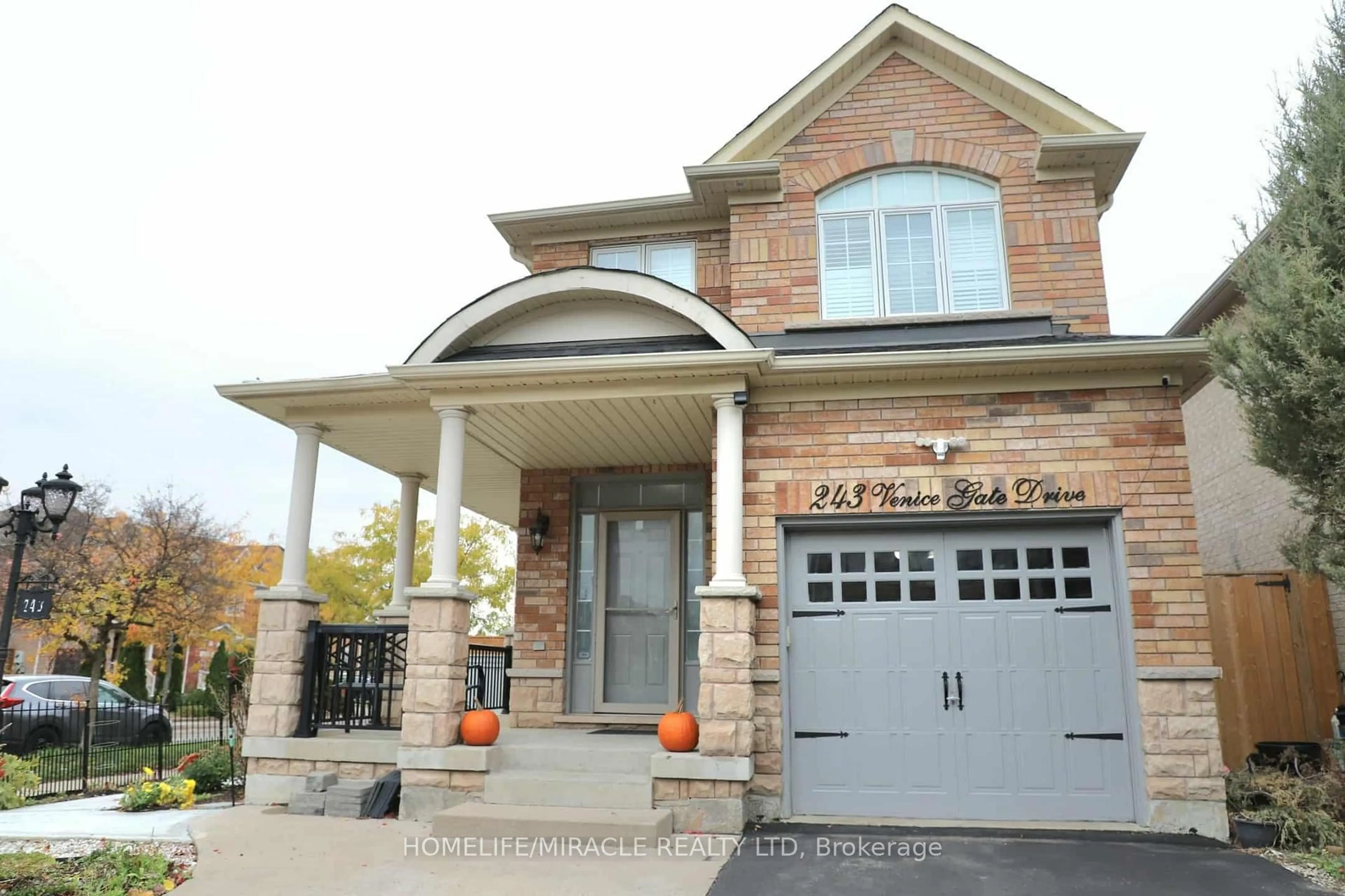 Home with brick exterior material, street for 243 Venice Gate Dr, Vaughan Ontario L4H 0G1