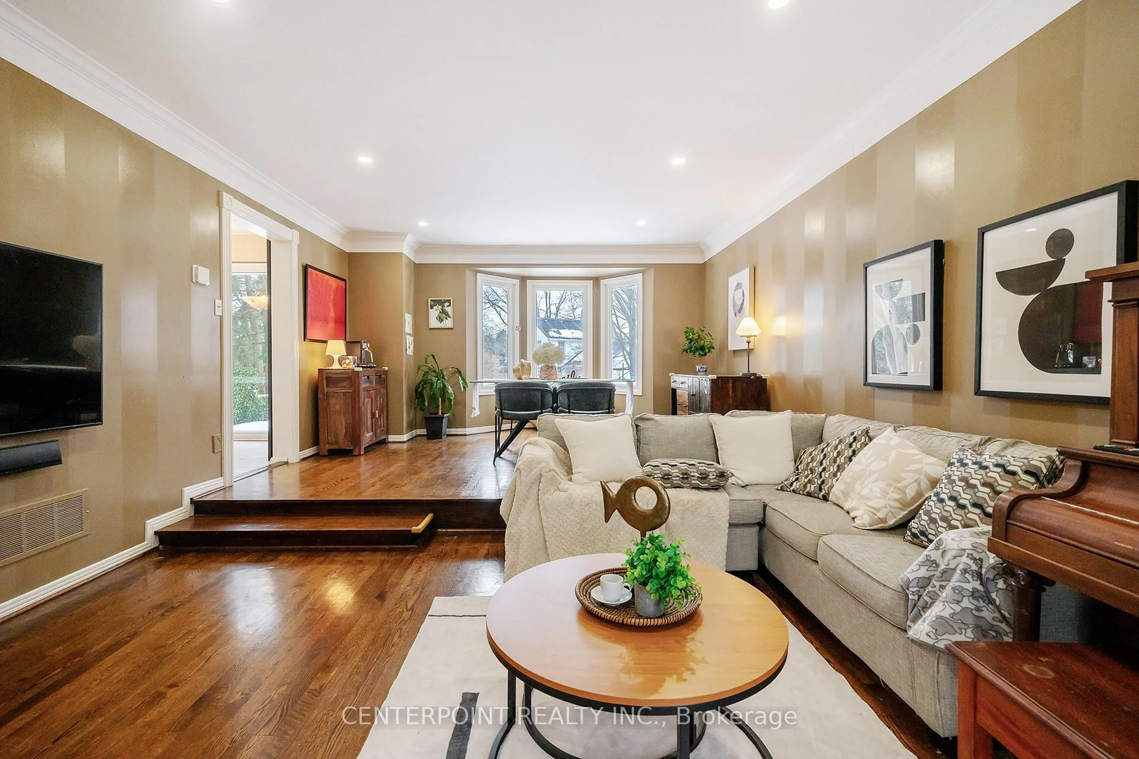 Living room with furniture, wood/laminate floor for 49 Redwood Lane, Markham Ontario L3R 3Z1