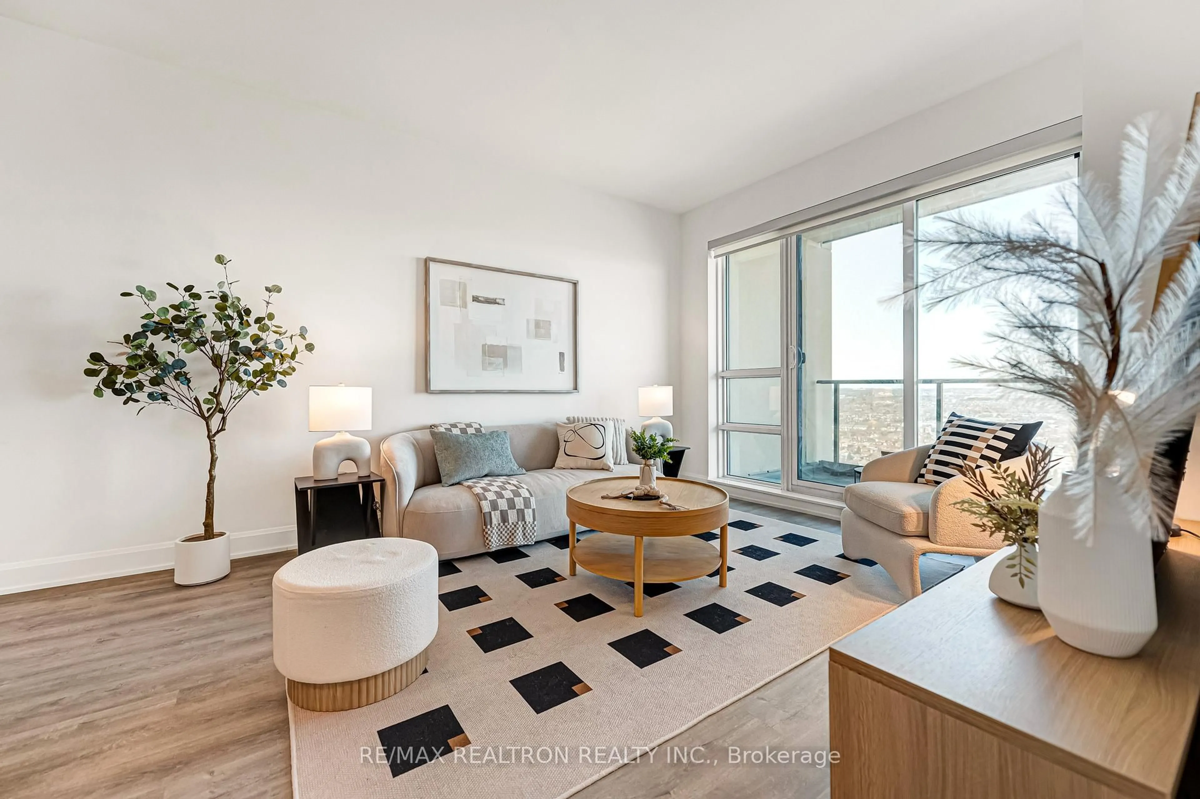 Living room with furniture, wood/laminate floor for 12 Gandhi Lane #3302, Markham Ontario L3T 0G8