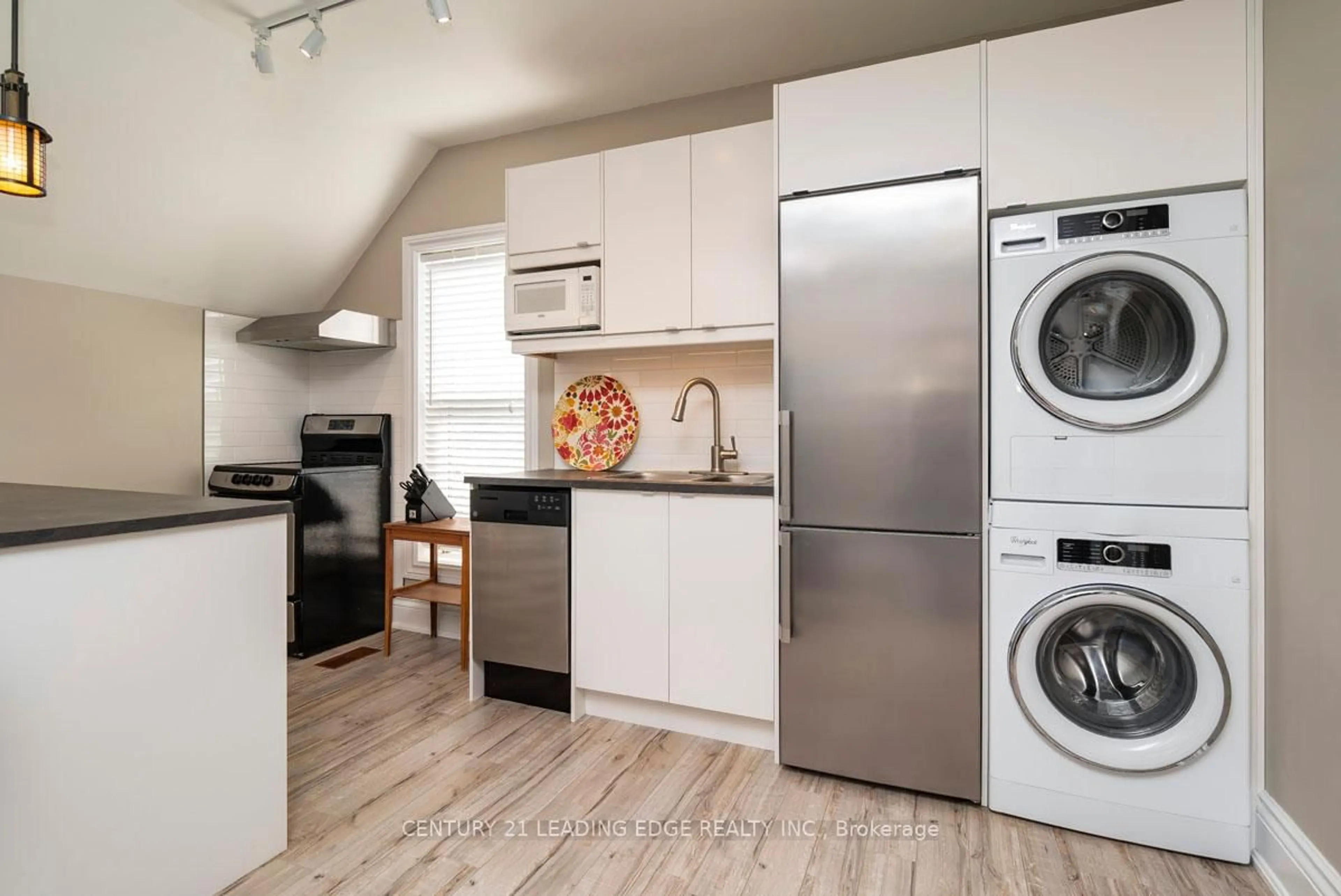 Kitchen with laundary machines, wood/laminate floor for 6391 Main St, Whitchurch-Stouffville Ontario L4A 1G4