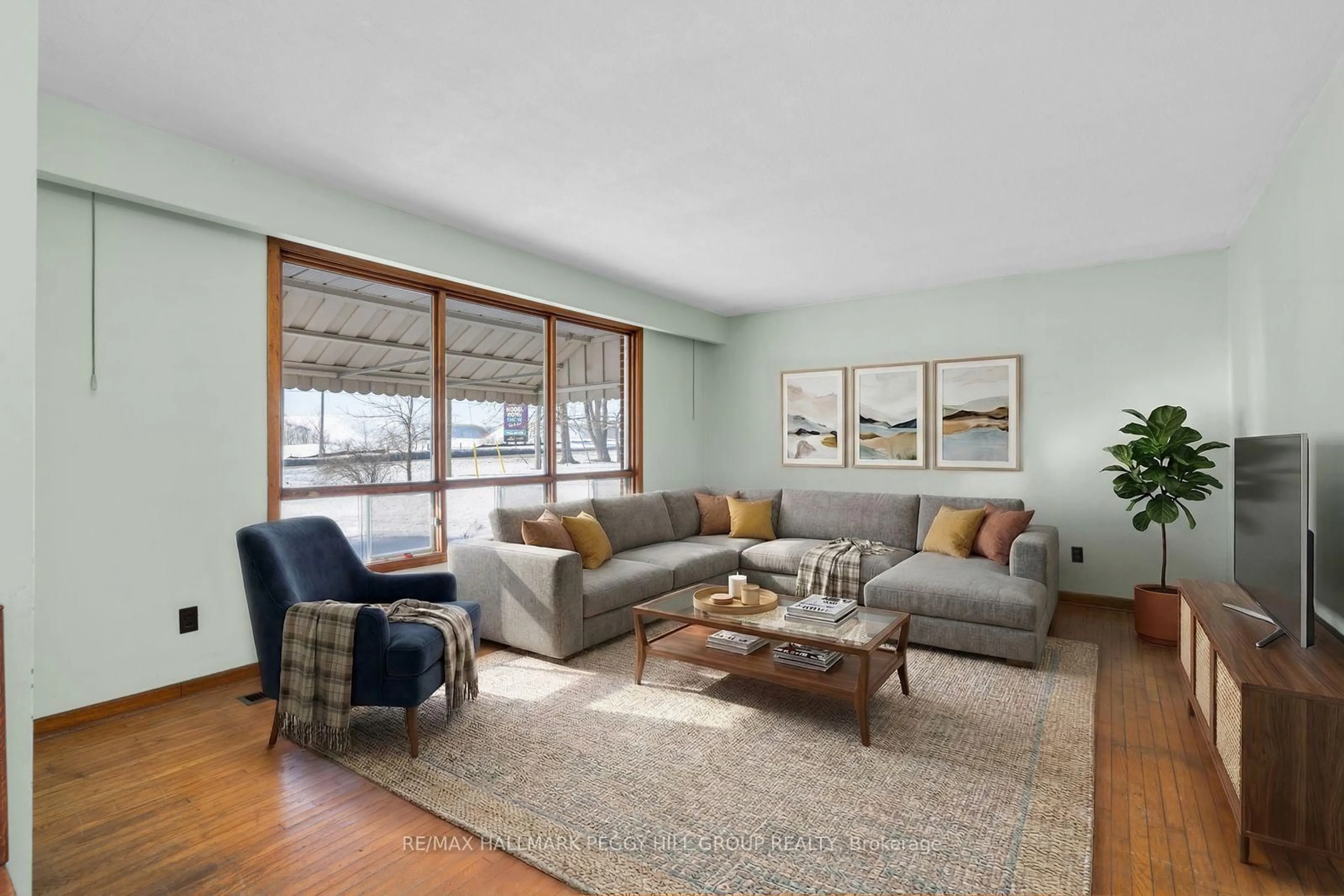 Living room with furniture, wood/laminate floor for 1646 Big Bay Point Rd, Innisfil Ontario L9S 2R3