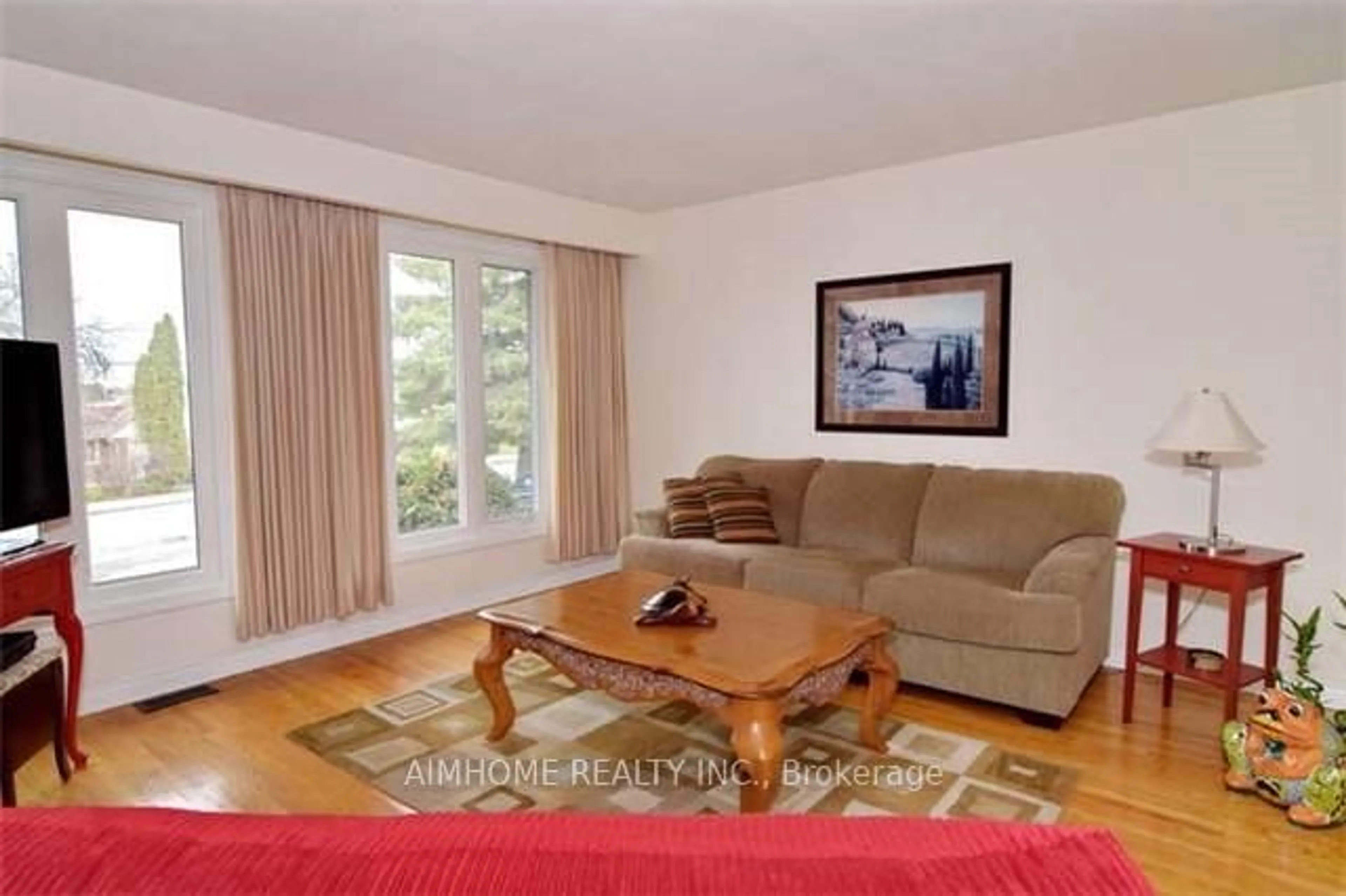Living room with furniture, wood/laminate floor for 133 Church St, Georgina Ontario L4P 1J4