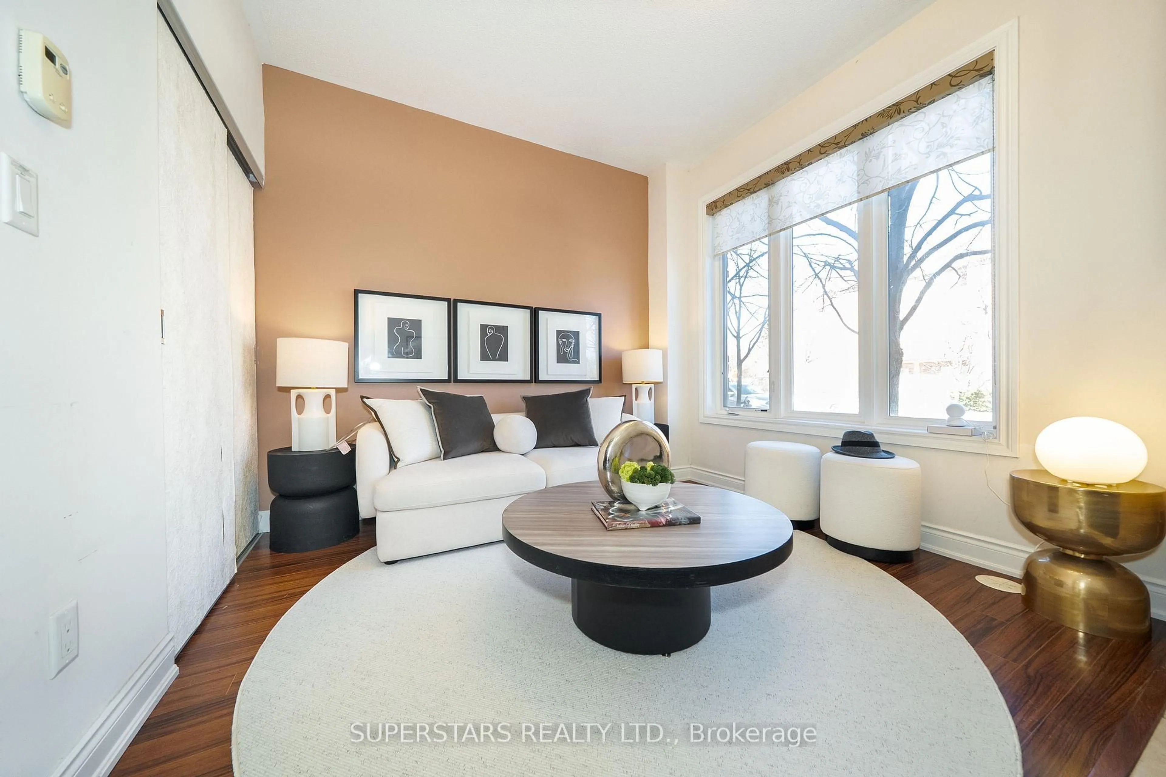 Living room with furniture, wood/laminate floor for 261 South Park Rd, Markham Ontario L3T 0B6