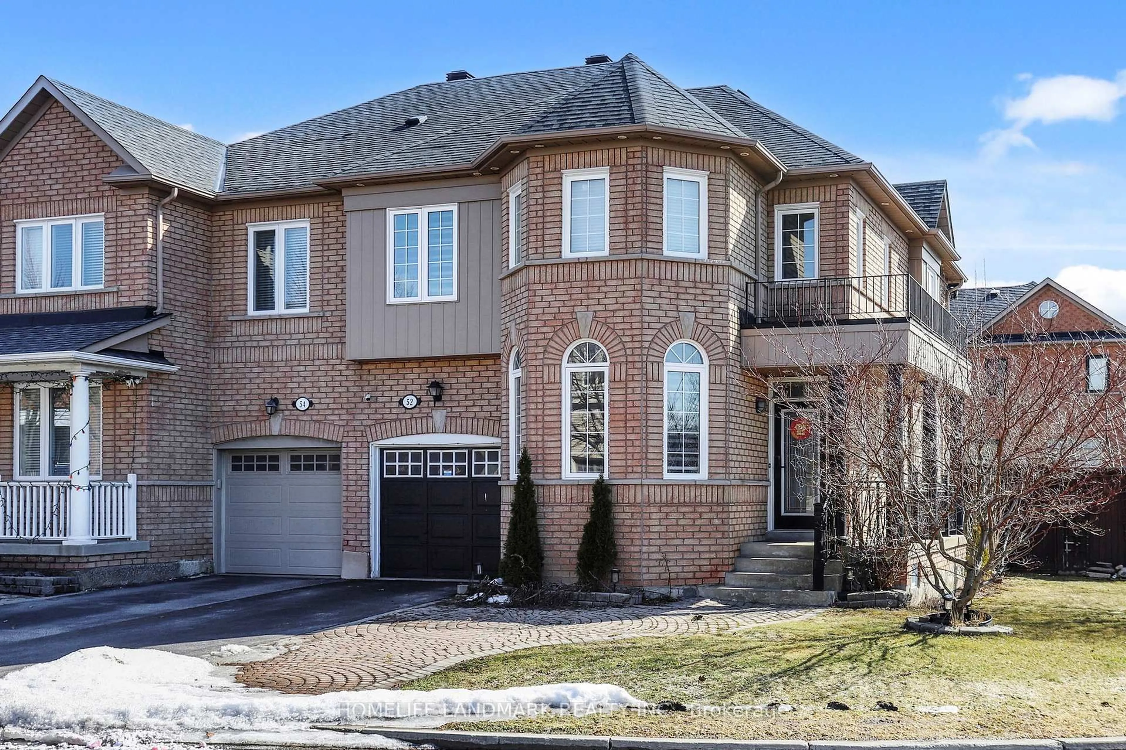 Home with brick exterior material, street for 52 Lakespring Dr, Markham Ontario L6C 2Z1