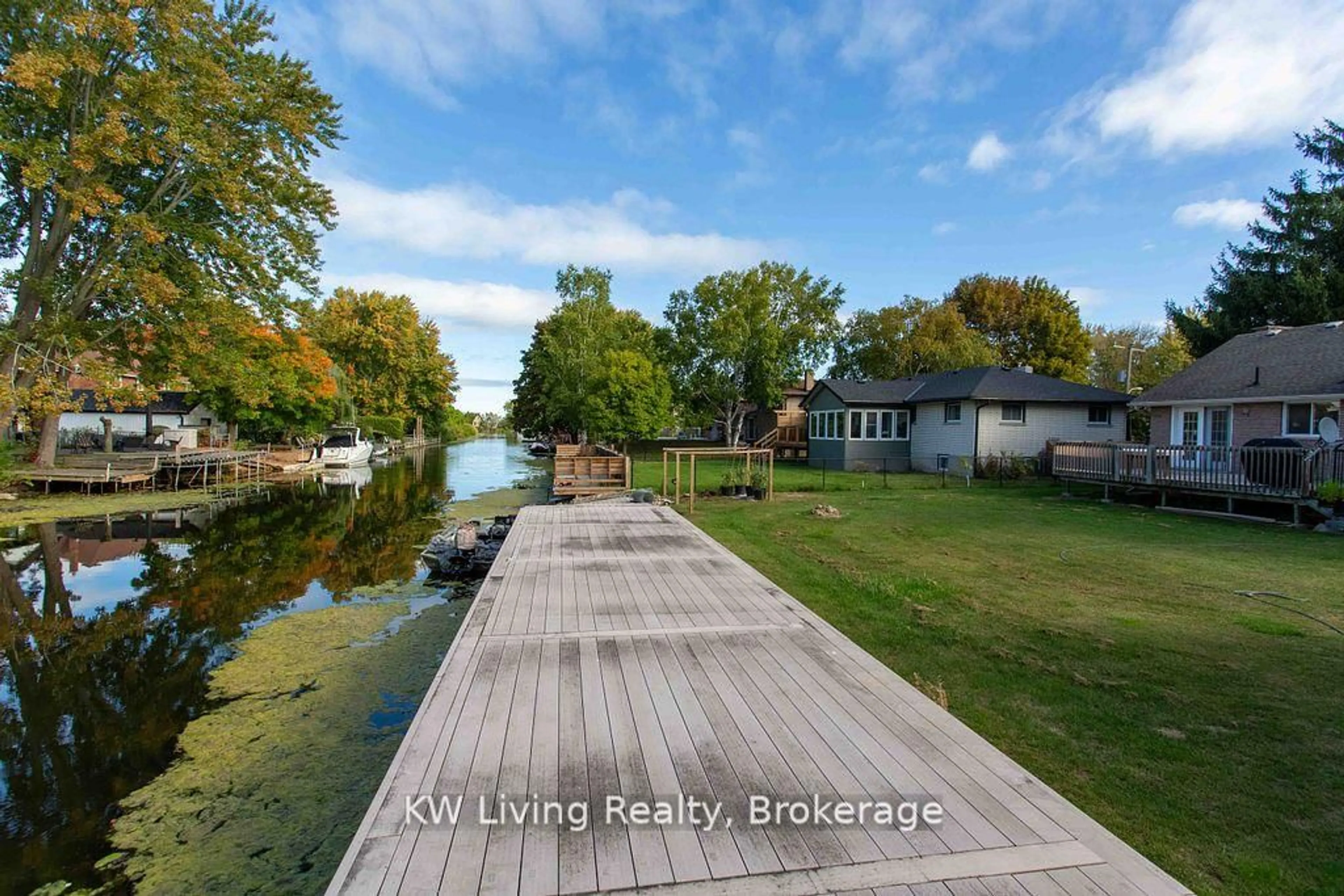 A pic from outside/outdoor area/front of a property/back of a property/a pic from drone, water/lake/river/ocean view for 702 Lake Dr, Georgina Ontario L4P 1V1