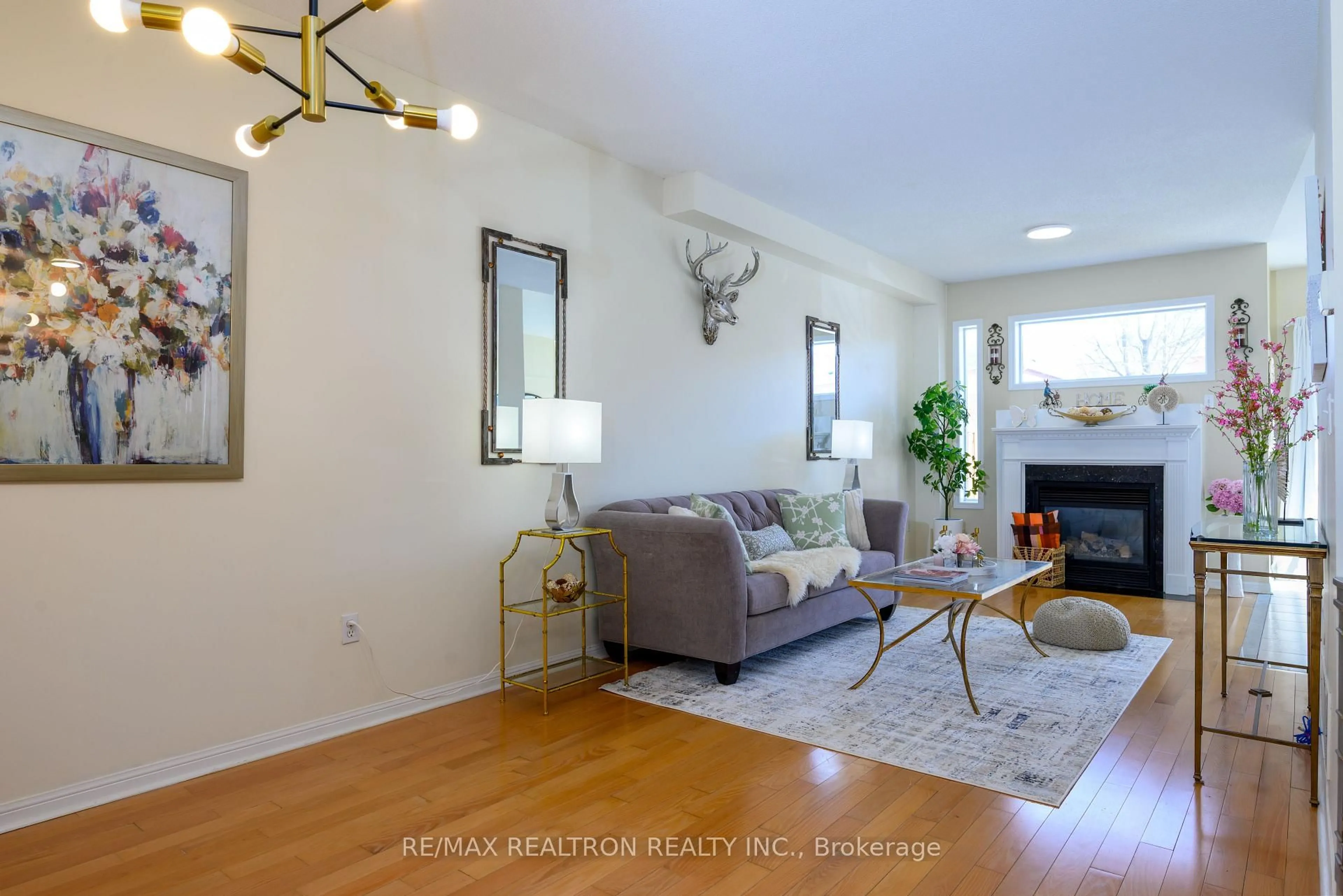 Living room with furniture, wood/laminate floor for 11 Zermatt Way, Markham Ontario L3R 5H9