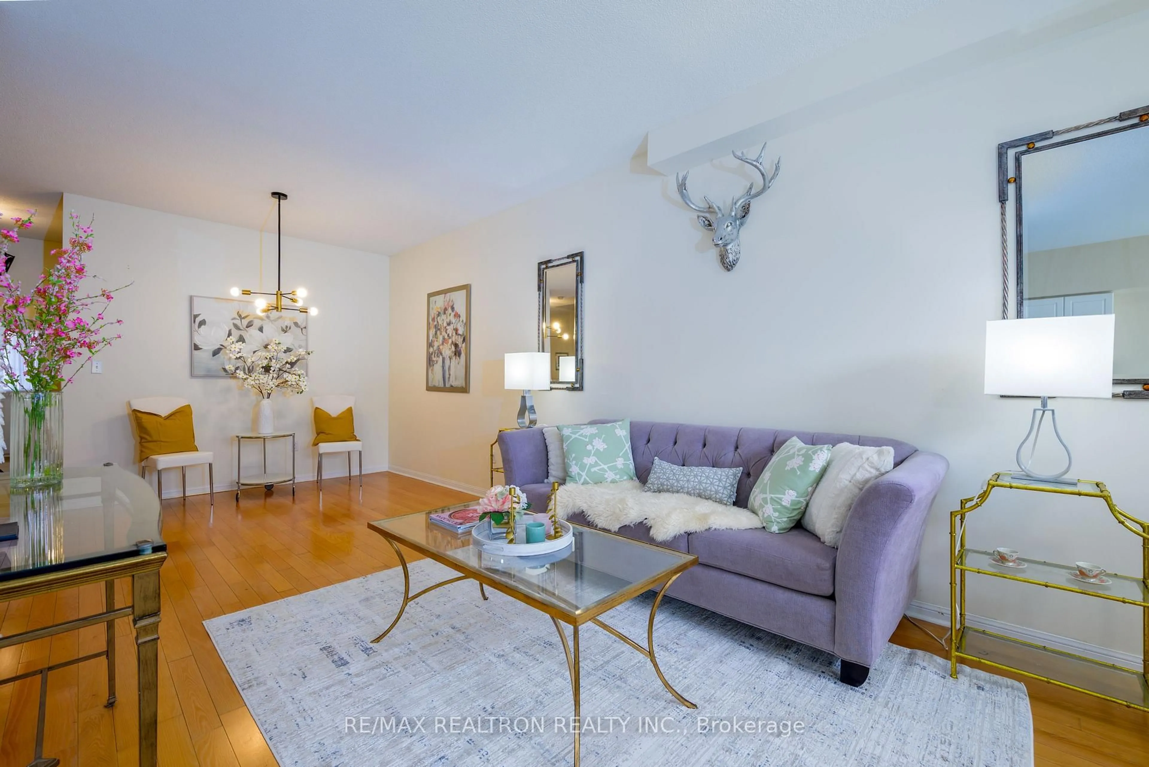 Living room with furniture, wood/laminate floor for 11 Zermatt Way, Markham Ontario L3R 5H9