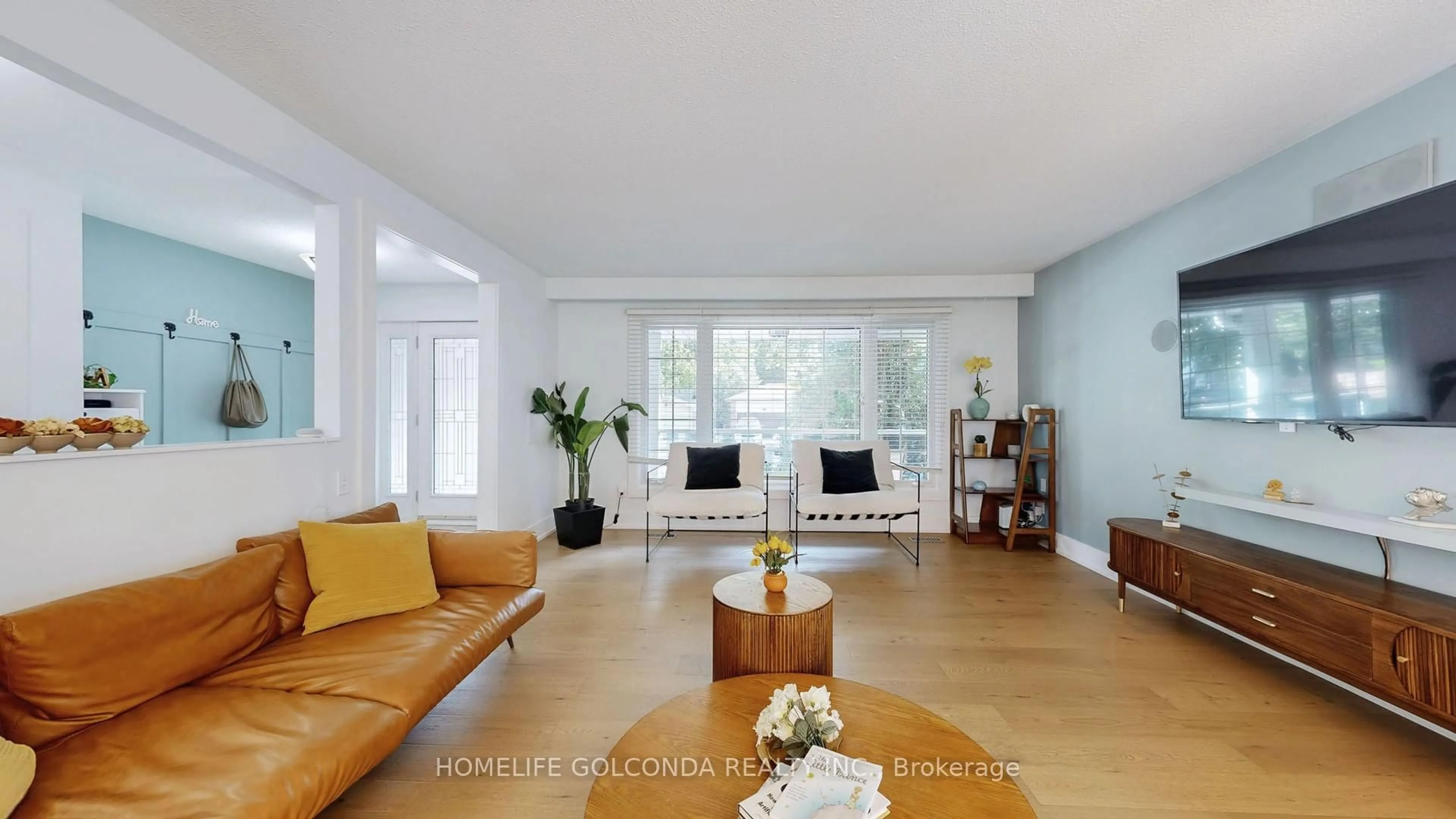 Living room with furniture, wood/laminate floor for 54 Senator Reesor's Dr, Markham Ontario L3P 3E2