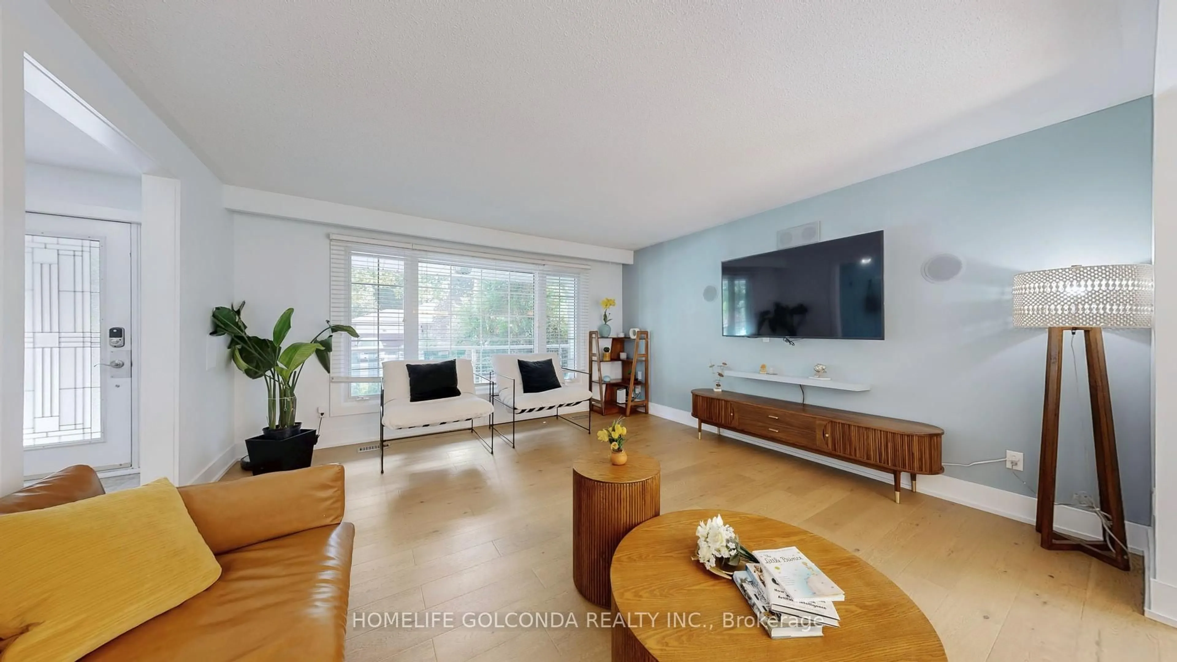 Living room with furniture, wood/laminate floor for 54 Senator Reesor's Dr, Markham Ontario L3P 3E2