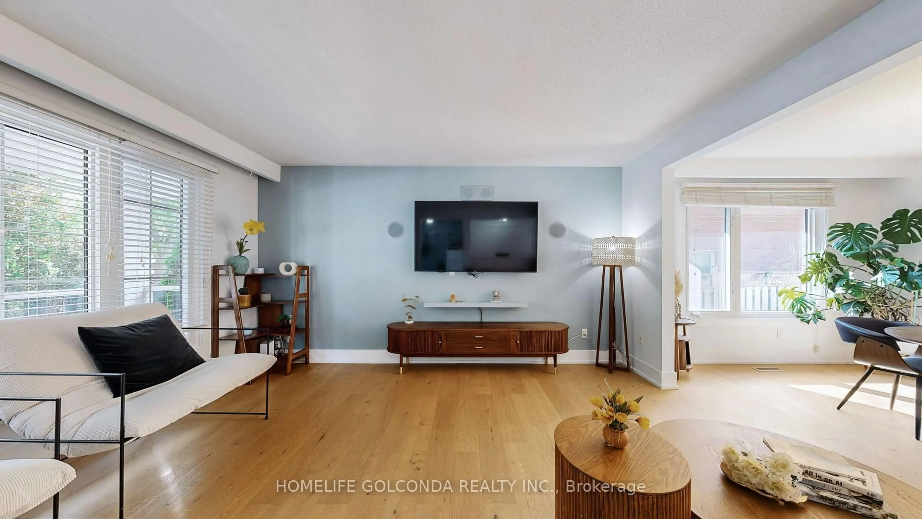 Living room with furniture, wood/laminate floor for 54 Senator Reesor's Dr, Markham Ontario L3P 3E2