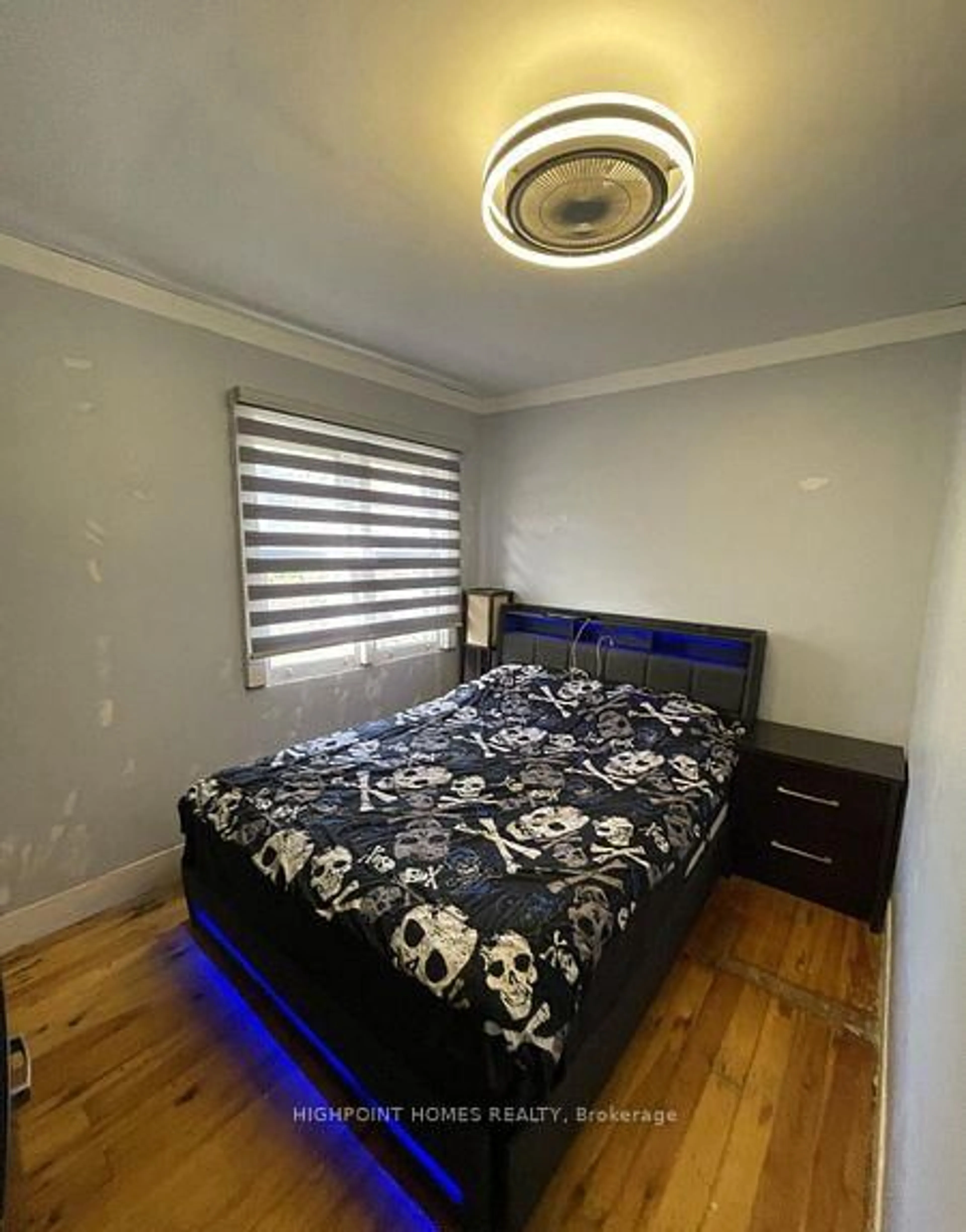 Bedroom with bed, wood/laminate floor for 257 Cedarholme Ave, Georgina Ontario L4P 2W5