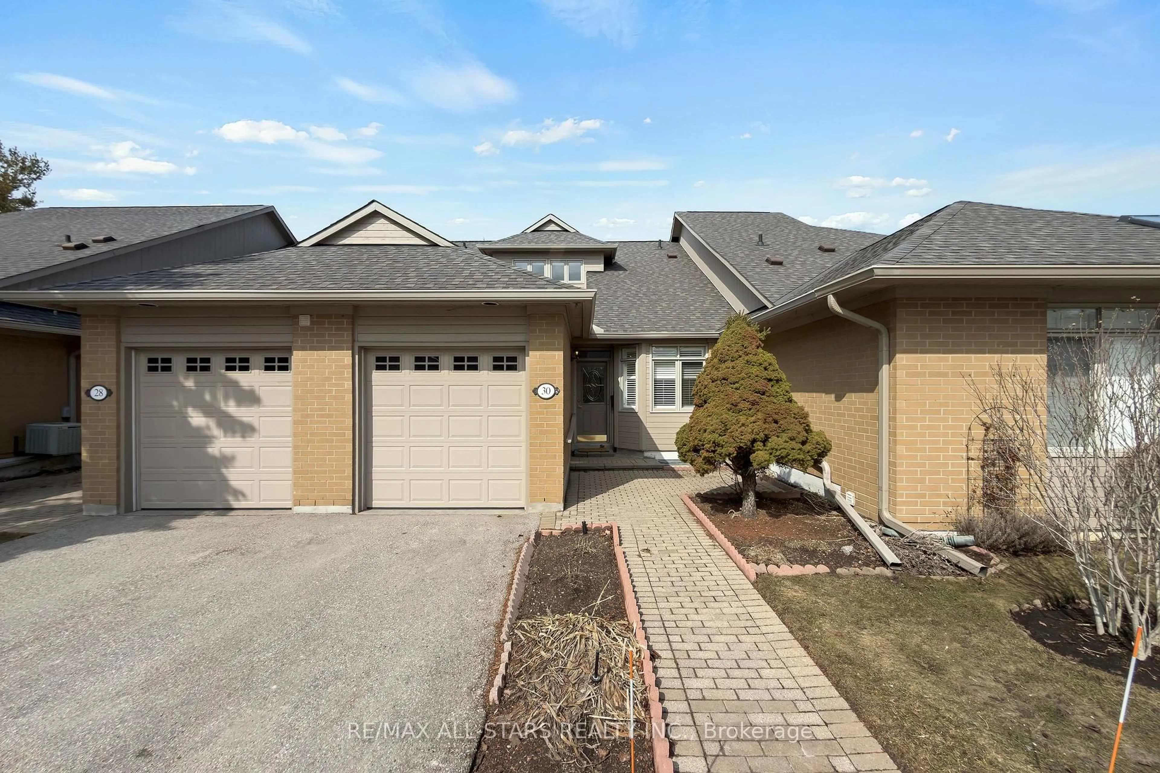 Home with brick exterior material, street for 30 Blue Heron Beach Way, Markham Ontario L6E 1B4