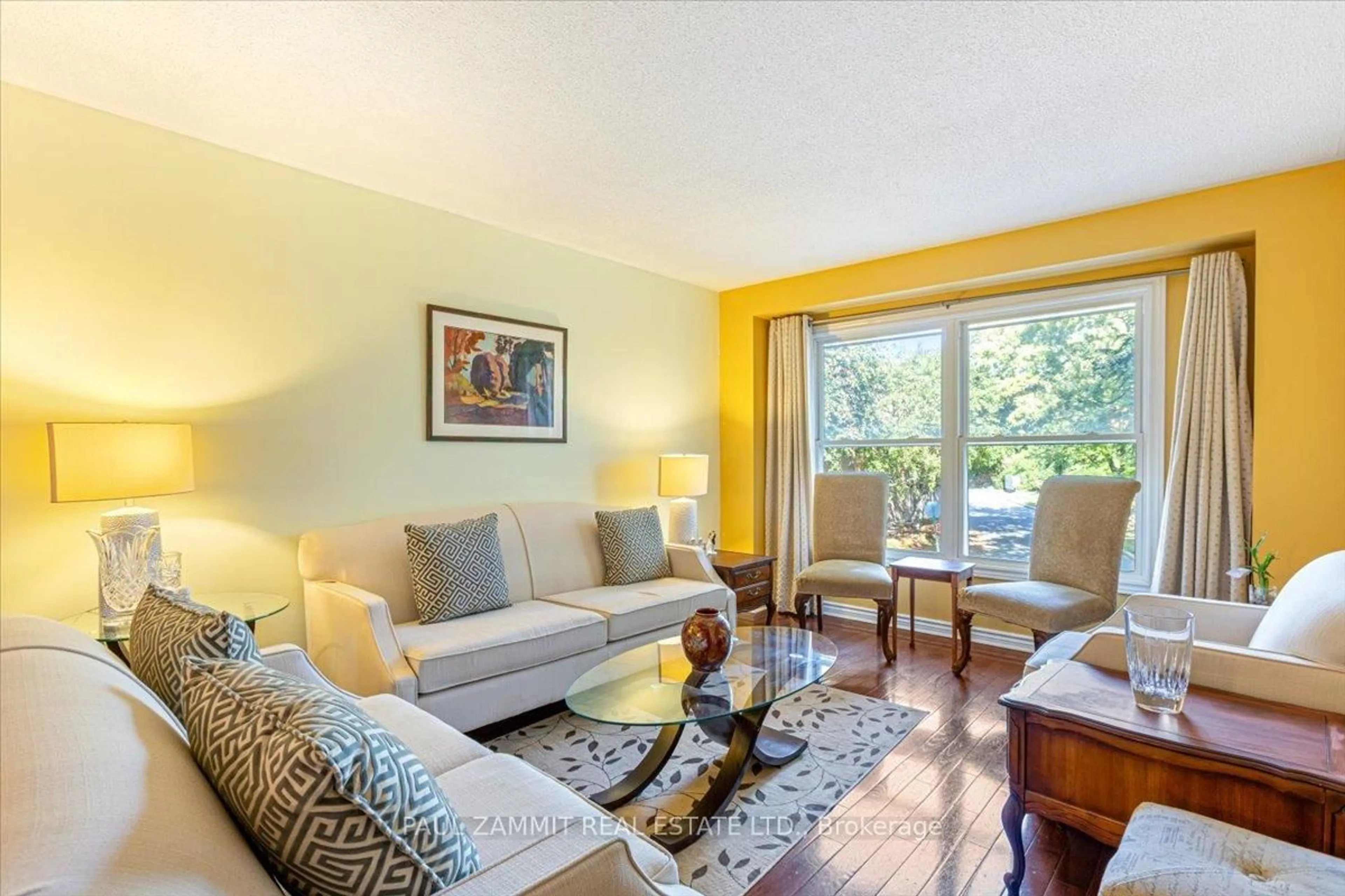 Living room with furniture, wood/laminate floor for 61 Nottinghill Rd, Markham Ontario L3T 4Y3