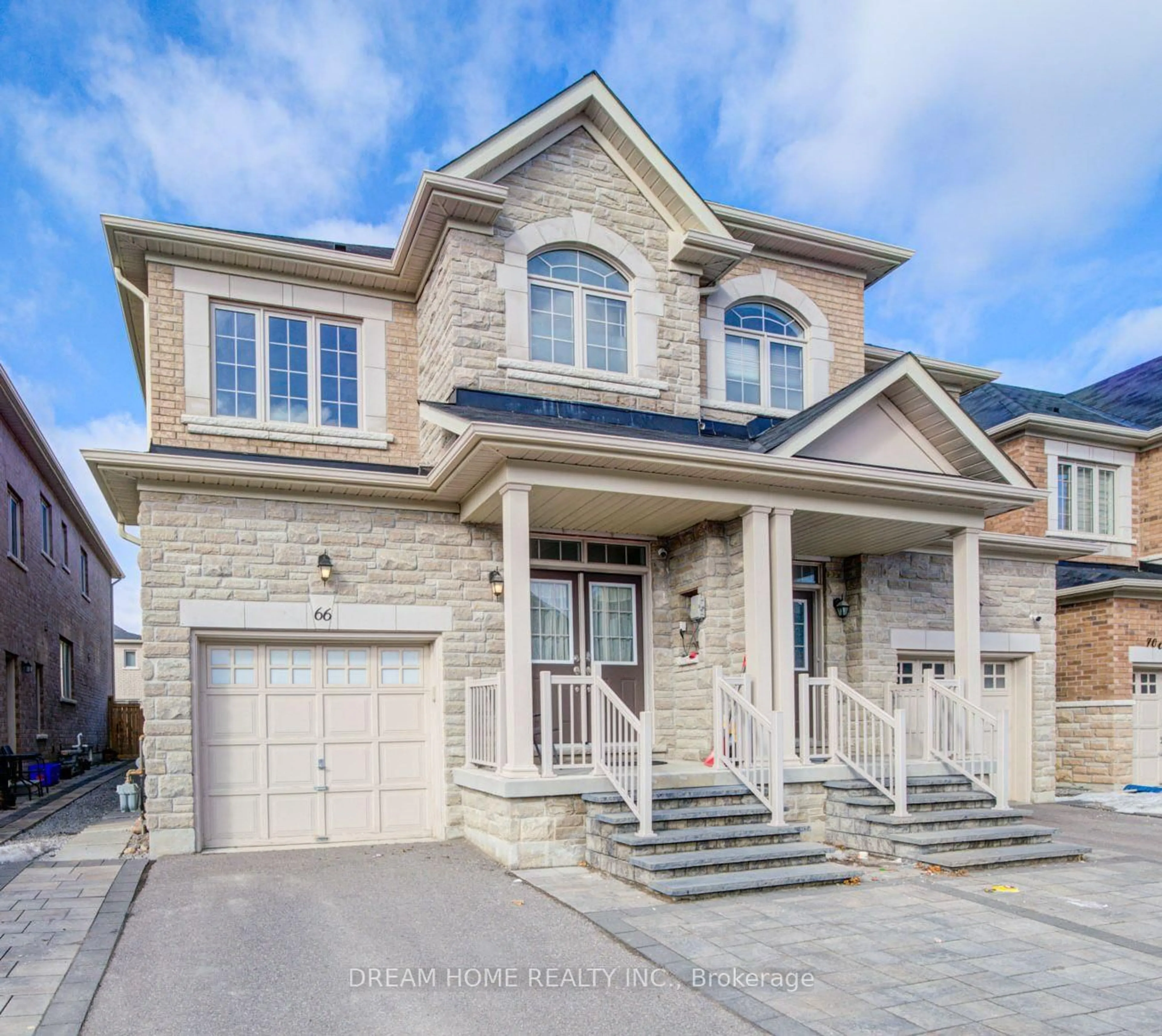 Home with brick exterior material, street for 66 Mohandas Dr, Markham Ontario L3S 0E4